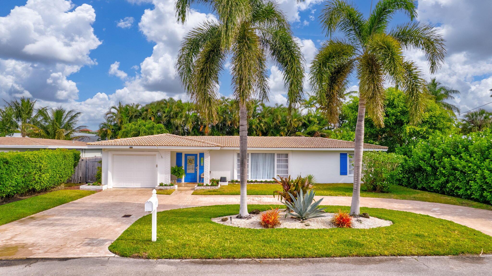 This charming home combines modern updates with retro flair, offering a unique and inviting atmosphere. The updated kitchen features sleek, contemporary finishes while maintaining a nod to vintage style. Terrazzo floors add character and timeless appeal throughout the home. Bright and airy, the space is bathed in tons of natural light, creating a warm, welcoming ambiance. Enjoy outdoor living in the private backyard, complete with a screened-in patio perfect for relaxing. A circular driveway enhances curb appeal and leads to a one-car garage, adding convenience. With a blend of style and functionality, this home offers a perfect retreat.
