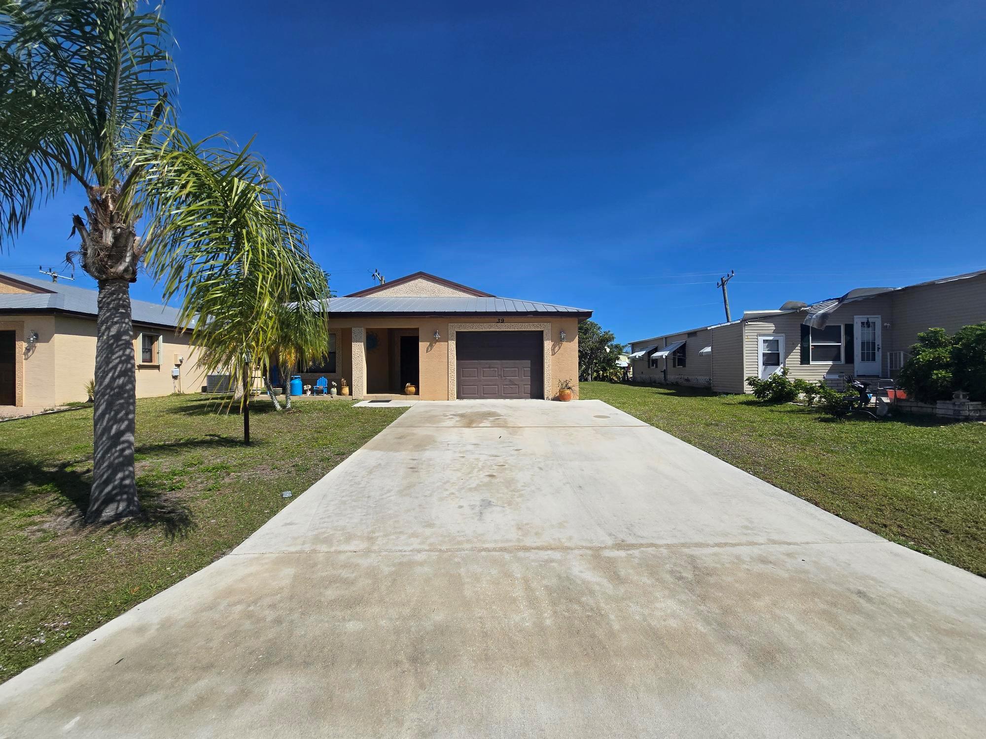 Spacious 2-Bedroom, 2-Bath CBS home in the desirable Spanish Lakes Country Club Village! Home does need some TLC. New Market Rent for new owner is $722.70. The home features laminate flooring, an upgraded kitchen with stunning granite countertops, and a 1-car garage for added convenience. The durable metal roof ensures peace of mind, while the Florida room offers a serene side view of the pond--perfect for relaxing and enjoying the peaceful surroundings. Some Photos do not reflect the actual home interior and are from a model home with same floorplan. The Amenities include: Heated Resident Pool & Guest Pool, Cantina/Club House Kitchen, Auditorium with Stage, Community Library, Lounge with Bar, Arts & Crafts, Billiards Hall, Gym & Sauna, Woodworking, & Card Room Outdoor Recreation:
2 Designated Pickleball Courts, Par 3 9-hole Golf Course
Lighted Shuffleboard, Tennis Courts, Horseshoes
Bocci, Dog Park
Total acreage - 330
Water/ sewer provided by Spanish Lakes Utilities