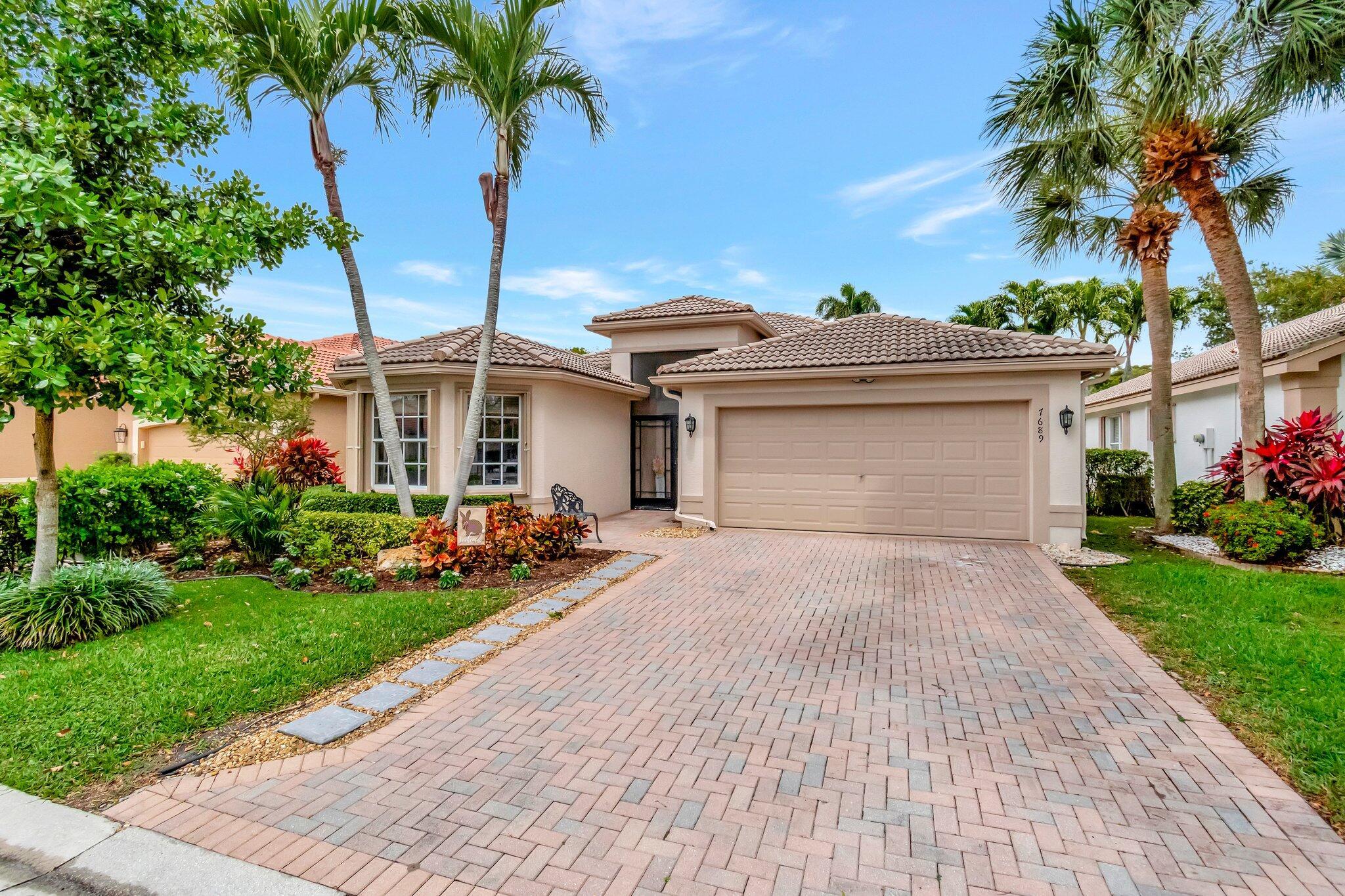 This is a meticulously renovated Coral model home located at 7689 Las Cruces Ct, Boynton Beach, Florida. Situated in a calm lakefront setting with room for a pool, it provides a respite from city noise while still affording easy commute access. The home invites you through custom glass doors into an interior boasting remarkable lake views from the living room, dining room, family room, and even the kitchen. The master suite is accentuated with bay windows, offering tranquil views of the lake. This serene space showcases an inherent design for relaxation and alleviation from the daily grind. The property is equipped with a recently updated air conditioning system (2018) assuring optimal, year-round comfort.The Hot Water Heater has been updated to a 2024 model. The outdoors echo the luxury of the indoors, indicating a spacious, tiled patio with accordion shutters.  This screened area is ideal for outdoor relaxation or a scenic al fresco dining experience.((Residing here implies more than just owning a home&#x14;it's about embracing a vibrant lifestyle. This property affords access to an admirable 55+ recently renovated clubhouse. Its amenities include refreshing pools, a well-equipped fitness center, tennis and pickleball courts, and an array of activities scheduled throughout the year.((Without doubt, 7689 Las Cruces Ct, Boynton Beach, holds the promise of a superior living experience rooted in comfort, style, and convenience.