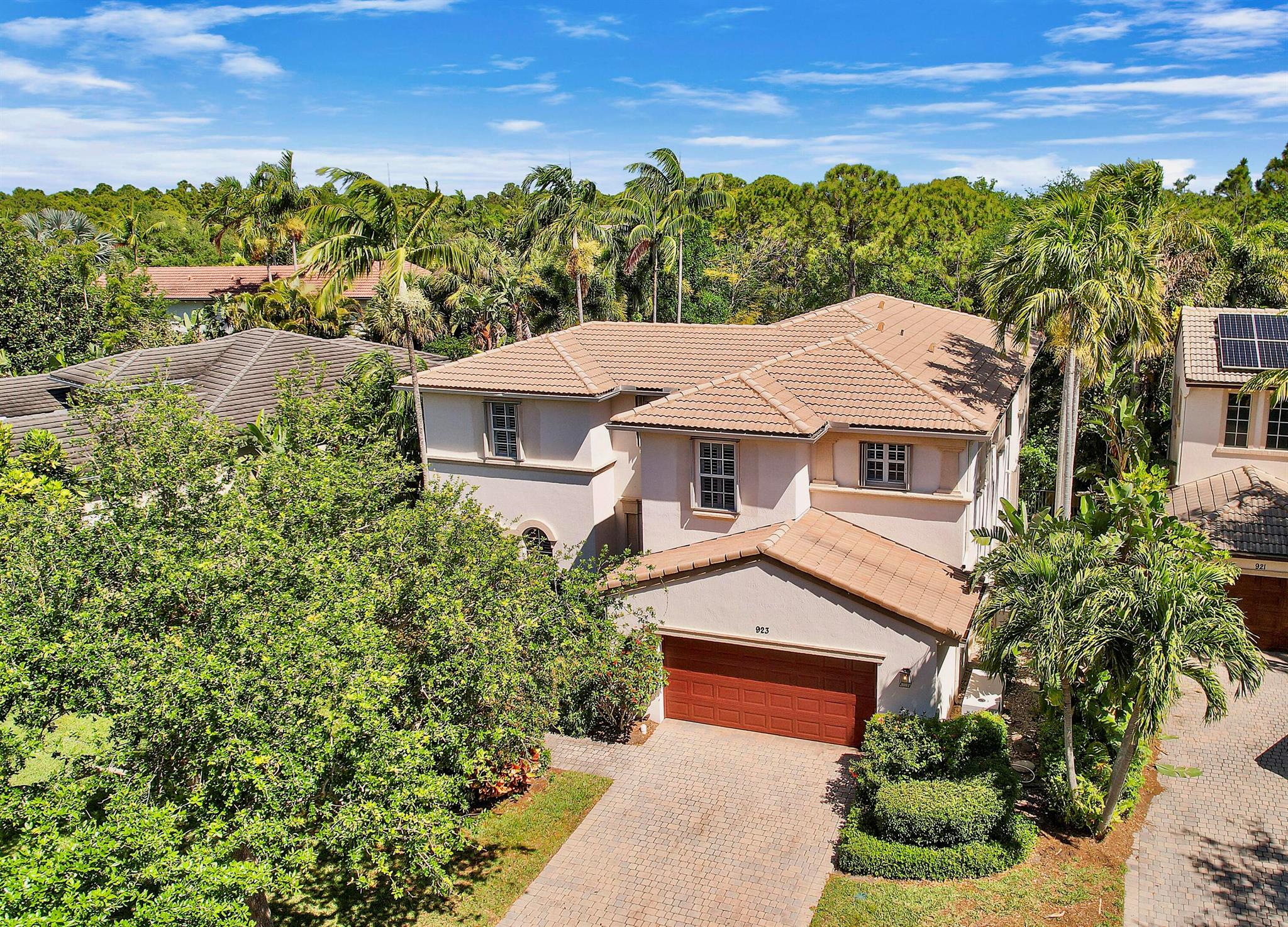Nestled on one of Evergrene's most sought-after streets, this Stonehaven model is a must-see! Featuring four spacious upstairs bedrooms, a chef's kitchen, & a stunning saltwater heated pool & spa, this home offers luxury, space & comfort. The oversized private yard backs up to a serene preserve, providing both privacy & natural beauty. The expansive master suite boasts dual vanities, a private balcony, & an enormous walk-in closet. Additional upgrades include instant hot water in the kitchen, a partial house generator 2.5-car garage top-quality laminate wood flooring, an oversized guest suite, built-in solar shades and plantation shutters, & a vented hood over the gas cooktop.