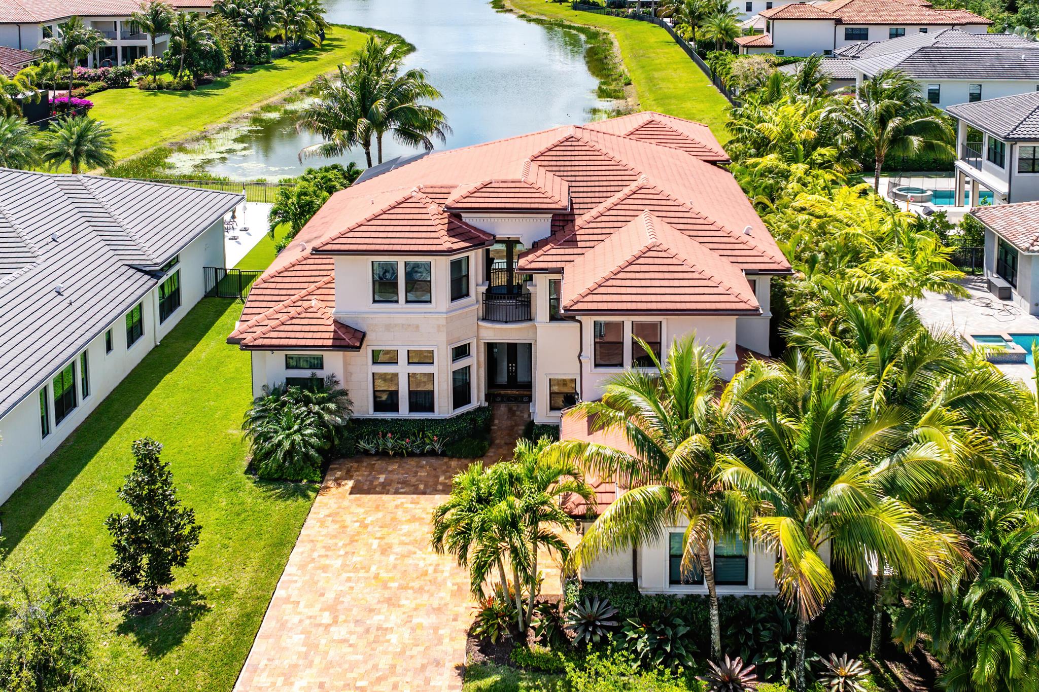 Exquisitely decorated and FULLY FURNISHED by Decorators Unlimited, this highly coveted Colonnade Grande floor plan is perfectly perched at the head of a long lake in Seven Bridges. This home showcases over $700,000 of extensive customization inclusive of luxurious marble and wood flooring, built-in home office, custom media room, designer light fixtures and window treatments, a full house generator and a sprawling one of a kind game room. The backyard oasis is fully screened and hosts a completely customized heated salt water pool with spa. Luxury living is redefined at Seven Bridges where residents have access to world class amenities including a gourmet restaurant, 3 pools, elite tennis program and fitness classes. Pickleball coming soon.