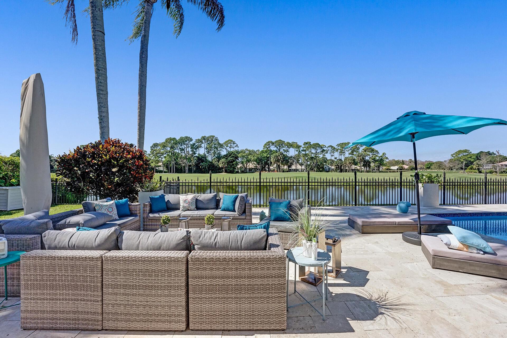 Absolutely gorgeous! Rare find! Stunning house on the water in PGA national on hole 7 Match course.Completely remodeled in 2020. The house feature 4 bedrooms with 4 bath pool on the water facing west with beautiful sunset on the Match course in PGA . French pattern travertine along the front entrance and back patio. Gorgeous Calcutta marble is found throughout the home, on the Kitchen Island, wet bar and in the Master Vanity. Rolling fog gray quartz surrounds the kitchen island as well. Cabinets are Shaker Smithport fine custom cabinets. This home has Puccini Perla 24in polished porcelain tile imported from Spain throughout the main level, including a custom Herringbone porcelain mantle with crown molding. Master bathroom has sport shower with polished porcelain. The view is stunning!!
