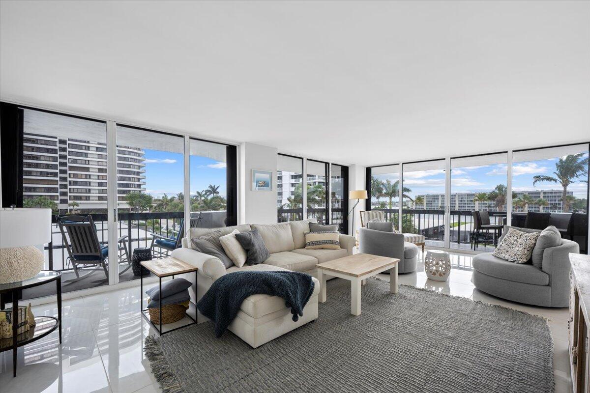Elegantly Refurbished to the Highest Standards. Nestled in the prestigious Old Port Cove Marina Tower in North Palm Beach, this residence offers unparalleled waterfront views. The home features two bedrooms and two bathrooms finished with custom cabinetry and modern appliances, including a new air conditioning system and a dedicated laundry room. The interior showcases exquisite white porcelain flooring imported from Spain, while the master bathroom is adorned with premium Hansgrohe fittings. Custom-fitted closets and solid core doors with Baldwin hardware add a touch of sophistication. The recently renovated interior hallways complement the outdoor spaces, which include a grill and hot tub area ideal for entertaining.