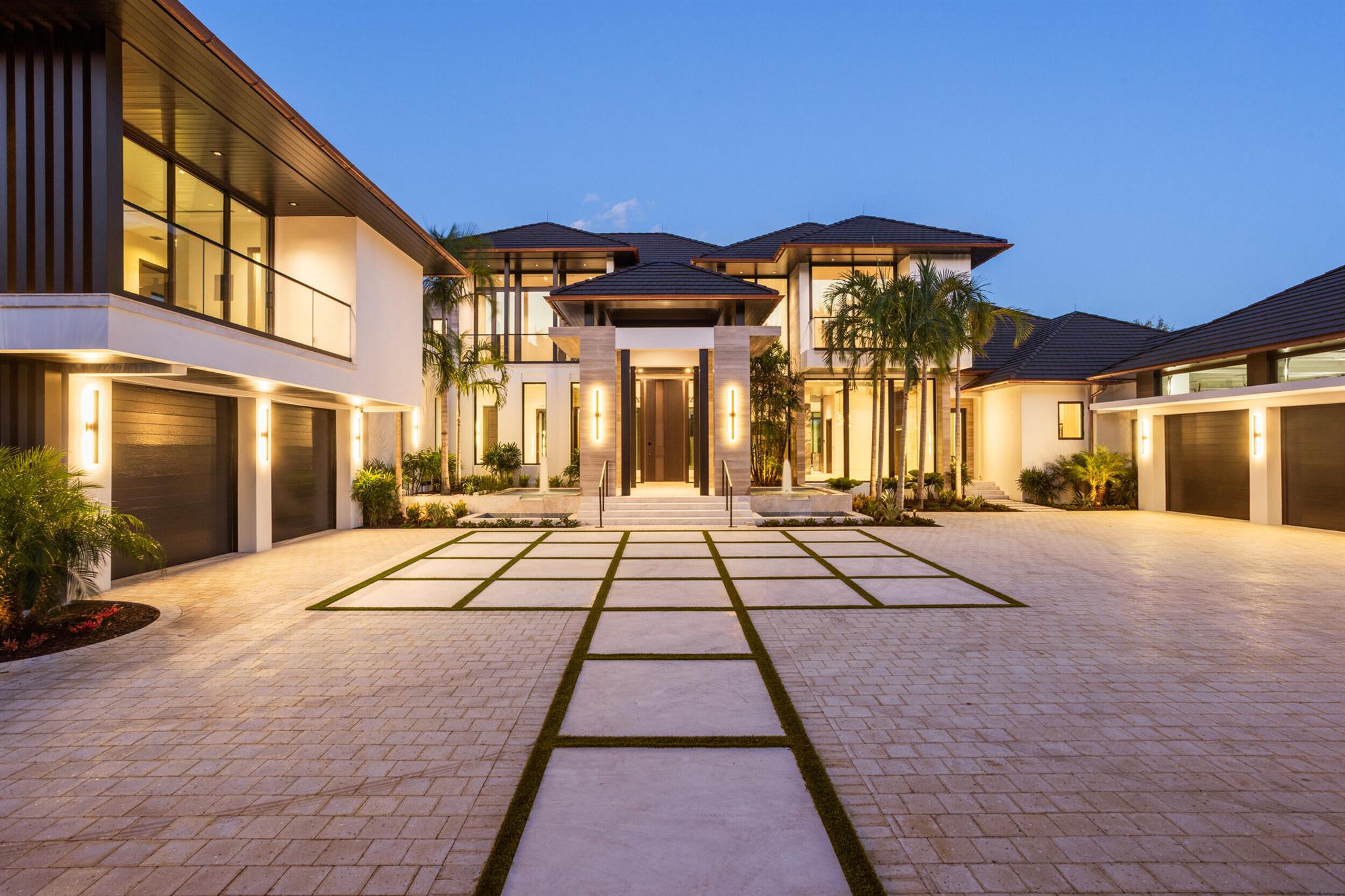 Welcome to 228 Bears Club Drive, a newly constructed masterpiece in the prestigious Bear's Club, Jupiter's premier luxury golf community. Designed by Decorators Unlimited with architecture by Randall Stofft and built by ON Shore Construction, this stunning estate spans an acre of private, lakefront land and showcases extraordinary craftsmanship throughout.As you enter, you're greeted by imported Italian creme brulee marble fountains, a grand 12-foot Oikos front door with fingerprint entry, and an open-concept living area with breathtaking views of the Jack Nicklaus signature-designed golf course. This 7-bedroom, 10-bathroom home features over 75 slabs of imported marble, custom oak accents, and floor-to-ceiling impact windows that flood the space with natural light. This exceptional home features 7 bedrooms, 10 bathrooms, and a 5-car garage, with ceiling heights designed to accommodate 3 lifts, totaling 8 cars. Additionally, there's a dedicated golf cart garage for ultimate convenience.

As you approach the front door, you're greeted by two impressive controlled fountains flanking either side of the driveway, crafted from imported Italian cr+¿me br++l+¬e marble slabs. The front porch, made from the same marble, seamlessly flows throughout the first floor. The grand entrance features a 12-foot Oikos front door with fingerprint entry, leading into an expansive front room highlighted by a Cippolino marble biofuel fireplace. The room also offers stunning views of the pool, lake, and golf course, complemented by a custom oak architectural feature on both sides of the poured concrete staircase. The space also includes an 1,680-bottle temperature-controlled wine cellar.

The kitchen is a chef's dream, featuring custom walnut cabinetry, marble countertops, and a dramatic waterfall island. A book-matched fabricated marble sink basin adds a unique touch. Wolfe appliances, including a double stove, microwave, steamer, and a bespoke "Pit" culinary system with elegantly integrated gas burners, make cooking a delight. A built-in Miele coffee maker and 2 dishwasher's add to the luxury. For those who have a personal chef, there is a hidden, expansive kitchen with a true refrigerator, 8-burner Wolfe range, and warming drawers.

The club room is designed with oak chevron flooring and includes a wet bar with an ice machine and wine cooler. The bar features a Fusion Berry Stone Palissandro Bronz polished marble top, and the room is complemented by a hidden theater, complete with custom soundproofing and sublimated acoustic fabric over individual leathered panels on the doors.

The master suite is unparalleled, offering separate his-and-her bathrooms with White Oak walls and fluted marble. A standalone tub, a -+-inch glass shower, and white fixtures add to the spa-like atmosphere. Ridge-less baseboards and a Caesarstone fireplace complete the space, which offers serene views of the backyard oasis.

Take the oversized elevator cab up to the second floor, where you'll find an expansive loft living area with a terrace overlooking the entire backyard. The guest suite features a luxurious bathroom with Sabrina polished marble and Kenya dark mosaic tile.

The interior doors throughout the entire home are premium Italdoors, imported from Italy, and the entire home is wired for automated window coverings.

No detail has been spared in the exterior design either. The property is adorned with 18x36 limestone Vino Grigio stone from Turkey on all columns, and an oversized covered lanai with an outdoor kitchen and a stunning quartzite see-through fireplace. The backyard includes a 15-seater sunken fire pit, a midnight blue PebbleTec pool with a spa and 4 pool heaters. Lush landscaping features exotic trees such as 5-prong Pandanus and Hong Kong Orchid. The roof is made of 100-year Verea clay tiles with a 10 year warranty, with two layers of underlayment and copper gutters. The home also includes a full-home 100kW generator, VPN router, and wireless access points for maximum comfort and convenience.

Every inch of this home has been crafted to perfection, making it one of the most exclusive properties in Northern Palm Beach County. This is a rare opportunity to acquire a masterpiece that stands apart in luxury, design, and craftsmanship.

The Bear's Club, founded by Jack and Barbara Nicklaus to offer a world-class golf and club experience, is the largest golf community in the area, spanning 400 acres with just 100 residences. Home to several PGA and LPGA tour players, it features an 18-hole championship golf course redesigned in 2023 by Jack Nicklaus. The club also includes a 9-hole par-3 course and a 24-hour practice area. The stunning 64,000+/- SqFt Tuscan-style clubhouse offers a dining room, private dining area, grill, lounge, and much more. Attracting professional golfers and sports stars alike, The Bear's Club is committed to excellence, providing the highest quality standards, exceptional amenities, and premier programs and services for its members and their guests.