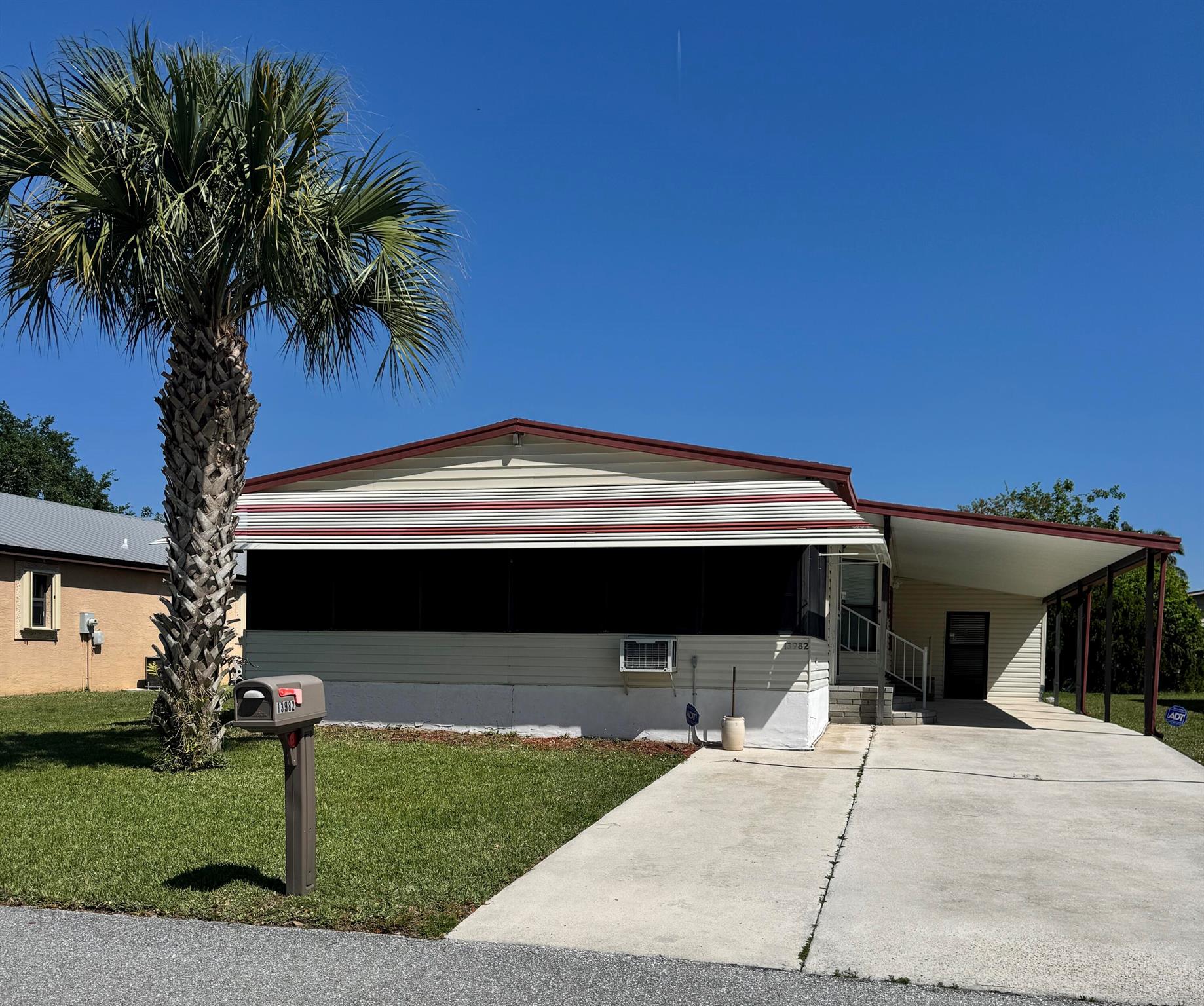 2bedroom 2 bath home on a quiet street in the desirable 55+Spanish Lakes Fairways community. Home has a large front room 14x22 that opens up to the kitchen and living area. Home has NO carpet. Laminate flooring throughout.Primary bedroom is full width of home. Large carport  big enough for 3 cars. Private backyard. Home has 2 sheds for added storage. Roof is metal 2023. A/C 2016. Water Heater 2021. Home is being sold partially furnished. Lawn care and trash removal included in lot rent. 2 pools, tennis, pickleball, bocceball, shuffle board, golf 18 hole golf course. club house and much more.