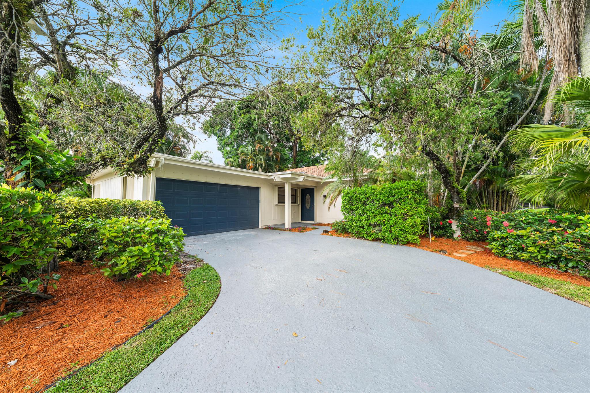 Priced way below market, move fast! Country Club living at its finest! Discover your dream home in the exclusive Eastpoint Country Club! This stunning 3-bedroom home has been fully renovated from top to bottom. Step into a designer kitchen featuring quartz countertops and brand-new appliances, perfect for your culinary adventures. You'll love the gorgeous new flooring and stylish lighting throughout, along with beautifully redone bathrooms. The home boasts abundant natural light, adding warmth and vibrancy to each room. An extra-large garage provides plenty of storage, and accordion shutters offer peace of mind.  Roof has 14+ years of life left per 4 pt inspection, replaced in 2008. 2023 HVAC. Don't miss out on this gem!