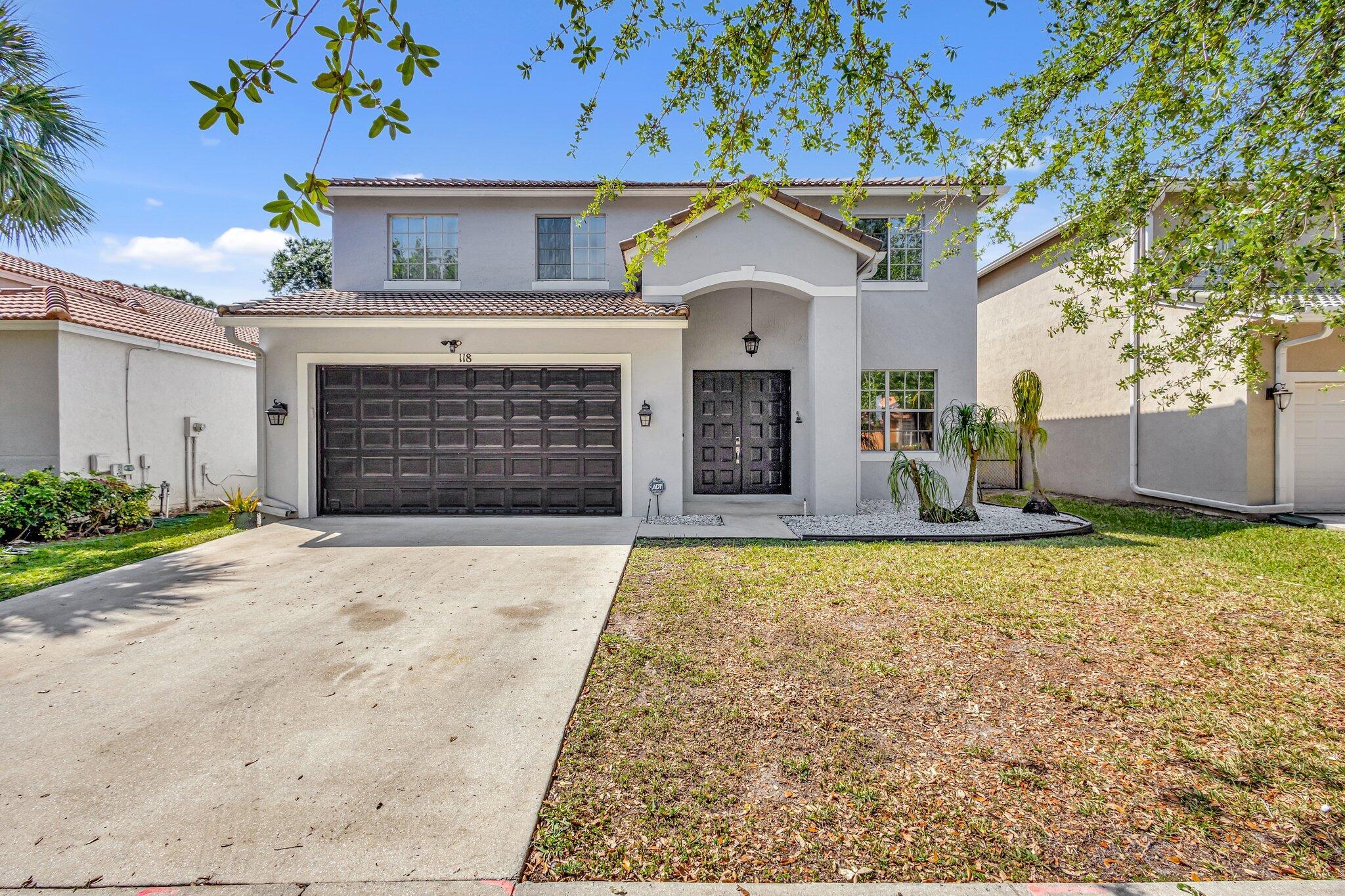 Don't Miss out on this beautiful 4-bedroom 2.5-bathroom home located in the gated community of Seminole Lakes Estates in Royal Palm Beach. This home boasts 2565 Square feet under air and boasts tile throughout the main floor and laminate upstairs. It features a formal living and dining room, with an eat-in kitchen and large pantry. Large Master Bedroom boasts 2 walk- in closets and tray ceiling. Master Bathroom has dual sinks, as well as a separate tub and shower. Most rooms overlook a large backyard with covered patio. All appliances were replaced in 2023 along with the A/C 2022, and the Water Heater 2021. Pride of ownership shows throughout! This home is centrally located near great schools, shopping malls, the airport and the beaches.  This is a must see!!