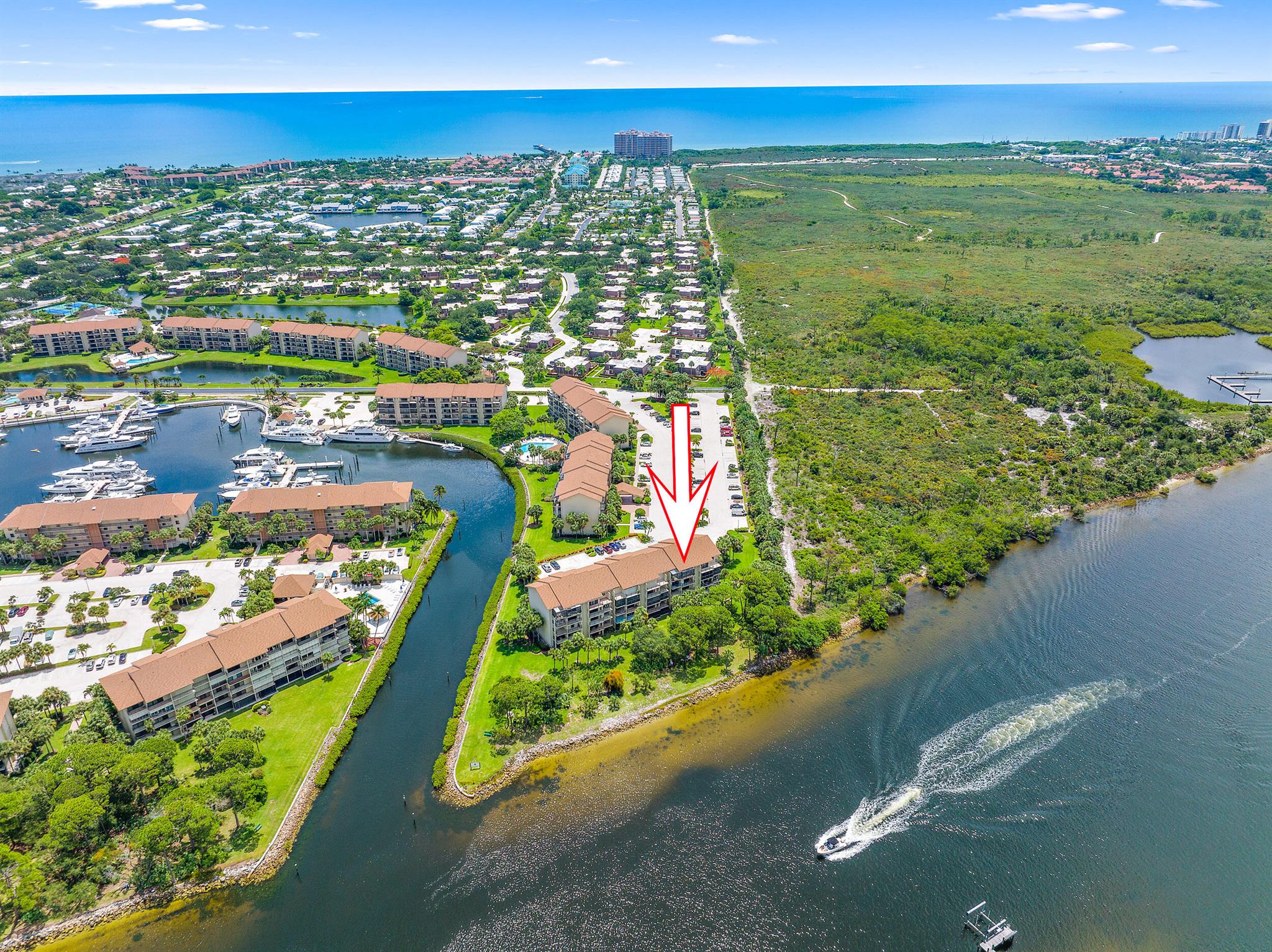 Incredible direct Intracoastal views with screened & tiled patio entire width of condo in marina community. Top floor condo has vaulted ceilings. Owner bedroom has large walk-in closet, plus a versatile flex room off the utility room can be used as extra bedroom, office, craft room, or den! The beach is a short distance away along with the plaza with Publix and restaurants such as Too Jays and Willie's NY Style pizza. This community is located near everything you dream about! World class golf, boating, shopping, and restaurants. Come live your best South Florida lifestyle less than half hour from Palm Beach International.