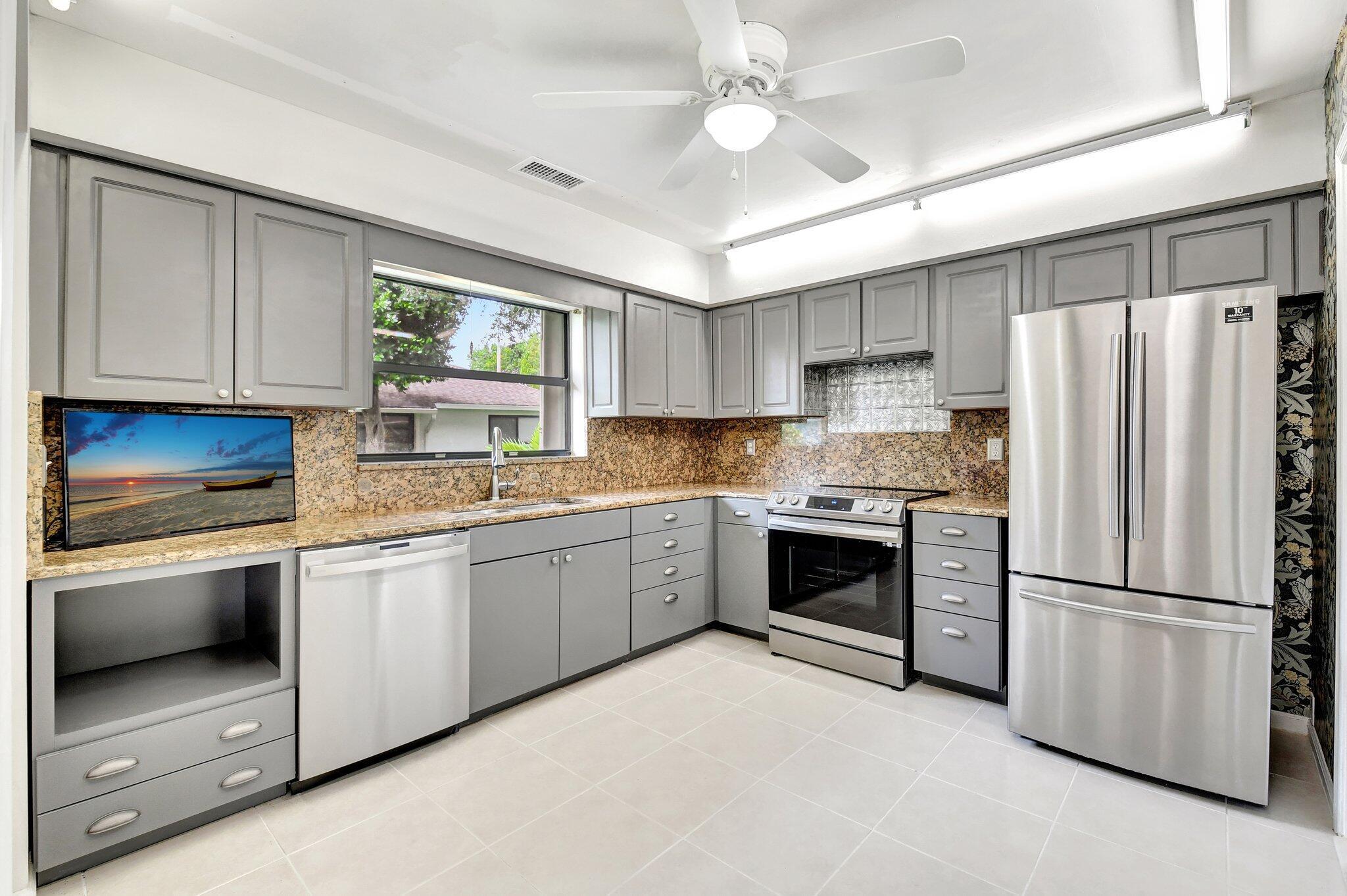 Beautifully Updated 2BR/2BA Villa in Bent Tree East - 55+ Community. Welcome to this spacious and meticulously maintained villa in the heart of Boynton Beach, offering comfort, style, and peace of mind. All updates and improvements are like new, making this home truly move-in ready. Inside, you'll find a bright open layout with an expanded Florida room that adds extra living space. The kitchen features granite countertops, a stylish backsplash, stainless steel appliances, and brand-new lower cabinets from American Woodmark. The smart Samsung range with air fryer and convection oven, along with the matching dishwasher are new , the refrigerator was replaced in 2020. The home has been freshly painted throughout and includes new carpet in the living room and bedrooms. Enjoy year-round comfort with a 2017 A/C unit, a smart Honeywell T6 Pro thermostat, and biannual professional maintenance since the purchase date. The living room ceiling is free of popcorn texture, adding a modern touch. Elegant new sheers and double transverse Desyne rods dress the large sliding doors, and all seven matching ceiling fans are new. Additional features include an in-unit washer/dryer hookup, an attached garage, and a private back patio perfect for relaxing outdoors. For storm protection, the home includes functional accordion shutters. 

The Bent Tree East community offers a saltwater pool, clubhouse, library, and billiards room. The low HOA fee includes cable, water, sewer, trash, roof and gutter maintenance, landscaping, and exterior building upkeep. Centrally located near shopping, dining, entertainment, and medical facilities, this clean and upgraded villa is ready for its next homeowner. Don't miss your chance, schedule your private showing today!