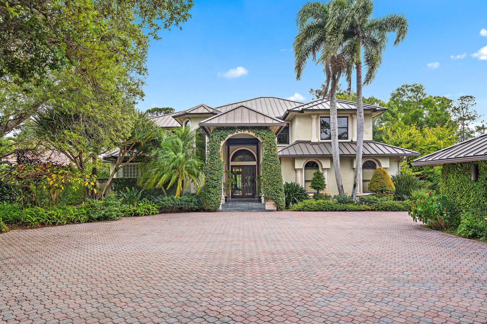 Riverfront Luxury Estate on the Loxahatchee River with Ocean Access!Experience the ultimate in waterfront living with this stunning estate on the Northwest Fork of the Loxahatchee River in Jupiter. Offering 5,455 sq ft of living space and 6688 sq ft total on a 3/4-acre lot, this 5 bedroom, 4 full and 2 half-bathroom residence blends elegance, privacy, and convenience. With river views, soaring ceilings, and an open, airy layout, this home is designed for sophisticated living.Step outside to your private tropical paradise, where lush landscaping surrounds a resort-style pool with a dramatic rock waterfall. The outdoor summer kitchen, complete with a full cabana bath and pizza oven, creates the perfect setting for alfresco dining and entertaining. A private dock with a boat lift .... provides direct ocean access, with the Jupiter Inlet just minutes away.
A detached flex space with -+ bath offers endless possibilities.&#x14;It can serve as a home office, gym, man cave, home theater or be converted into a two-car garage. Freshly painted, this estate provides a blank canvas for its next owner to customize and make their own.
Ideally located just minutes from I-95 and the Florida Turnpike, this home offers easy access to world-class shopping, dining, beautiful beaches, and the golfing mecca of Palm Beach County. Plus, it's conveniently close to major airports, making travel effortless.
A rare opportunity to own a piece of paradise!&#x14;Schedule your private tour today!