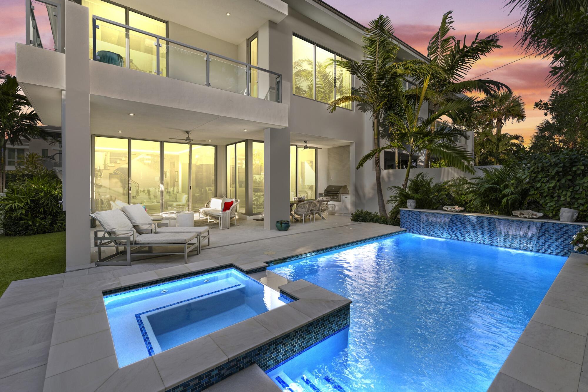 Contemporary Model townhome in boutique enclave of 22 residences steps away fr the Atlantic Ocean. Palm  Beach designer appointed every imaginable detail/upgrade. Openfloorplan w/5 bedrooms, 5 full baths, 2 CG. Open loft w/full bar. Expansive rooftop deck w/oceanviews and media area. Lush landscaping, turf grass, heated resort style saltwater pool/spa w/waterfall. South Exposure.Summer Kitchen. Chefs kitchen w/architectural cabinetry, Wolf appliances, 10ft quartz island, countertops, backsplash, walkin pantry. Soaring floor to ceiling 10 ft.sliders. Spacious laundry room w/tons of storage /sink. 24x48 porcelain tile floors, elevator, glass/steel staircase, 3 balconies, custom huge walk-in closets, designer light fixtures, motorized window treatments. Smart high speed technology/security