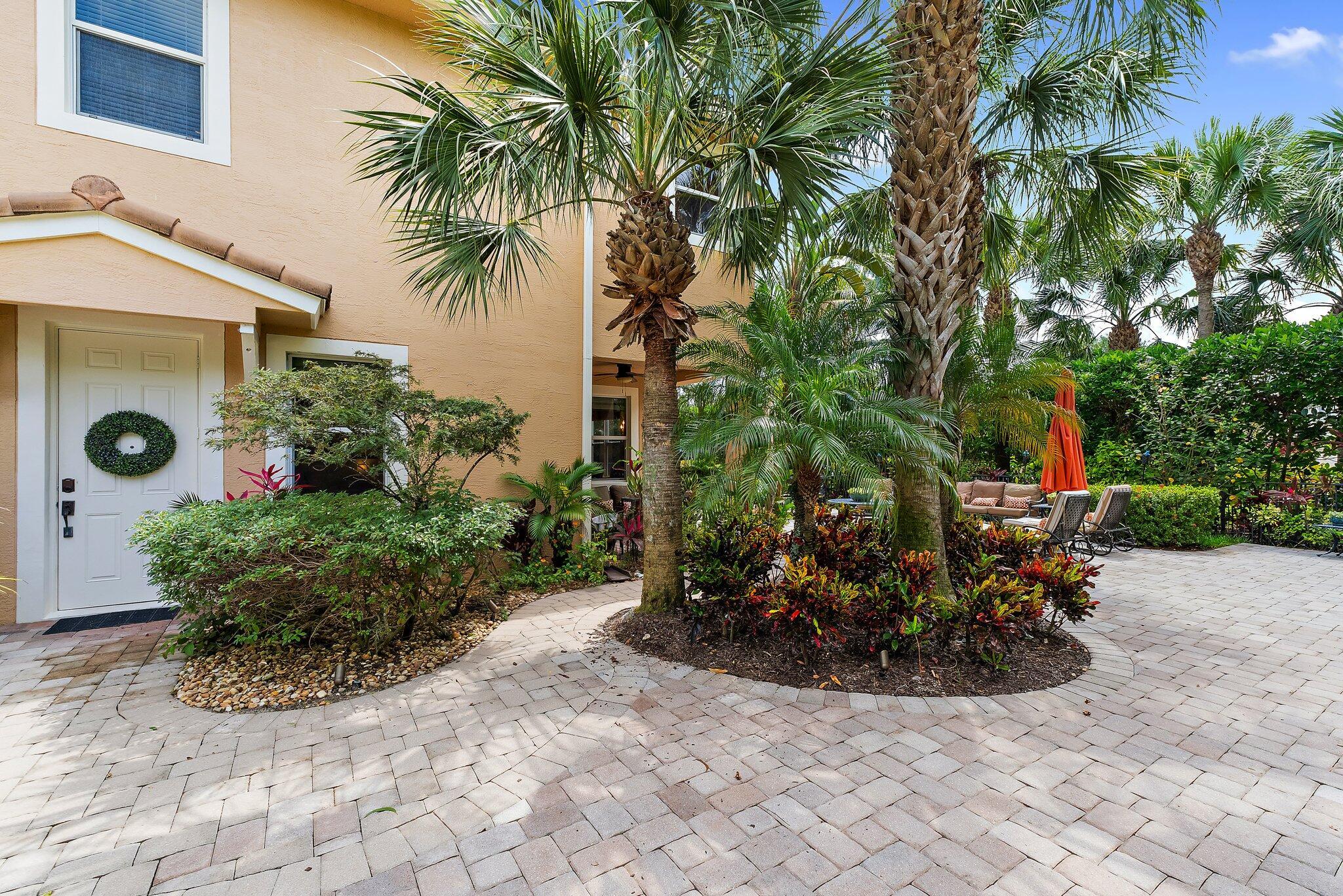 Nestled behind the gates of Paloma in Palm Beach Gardens, this 3-bedroom, 2.5-bath residence offers resort-style living with a private outdoor patio oasis, lush tropical landscaping, and the ease of low-maintenance luxury.Set on a desirable corner lot with an extended driveway, this home delivers added privacy, extra parking, and a more open feel. Inside, the layout is thoughtfully designed with oversized bedrooms, ample storage, and an upgraded kitchen outfitted with newer stainless steel appliances--all replaced within the past 3 years. High ceilings and well-placed windows enhance the flow of natural light without sacrificing efficiency or comfort.Impact windows provide peace of mind, and a meticulously maintained A/C keeps things cool year-round. The HOA covers essentials like lawn care, irrigation, cable, and ADT security&#x14;freeing up your weekends to relax or entertain in your private garden escape.

Just minutes from pristine beaches, PGA dining, elite shopping, and top-rated schools, this Paloma gem offers the perfect mix of luxury and location.