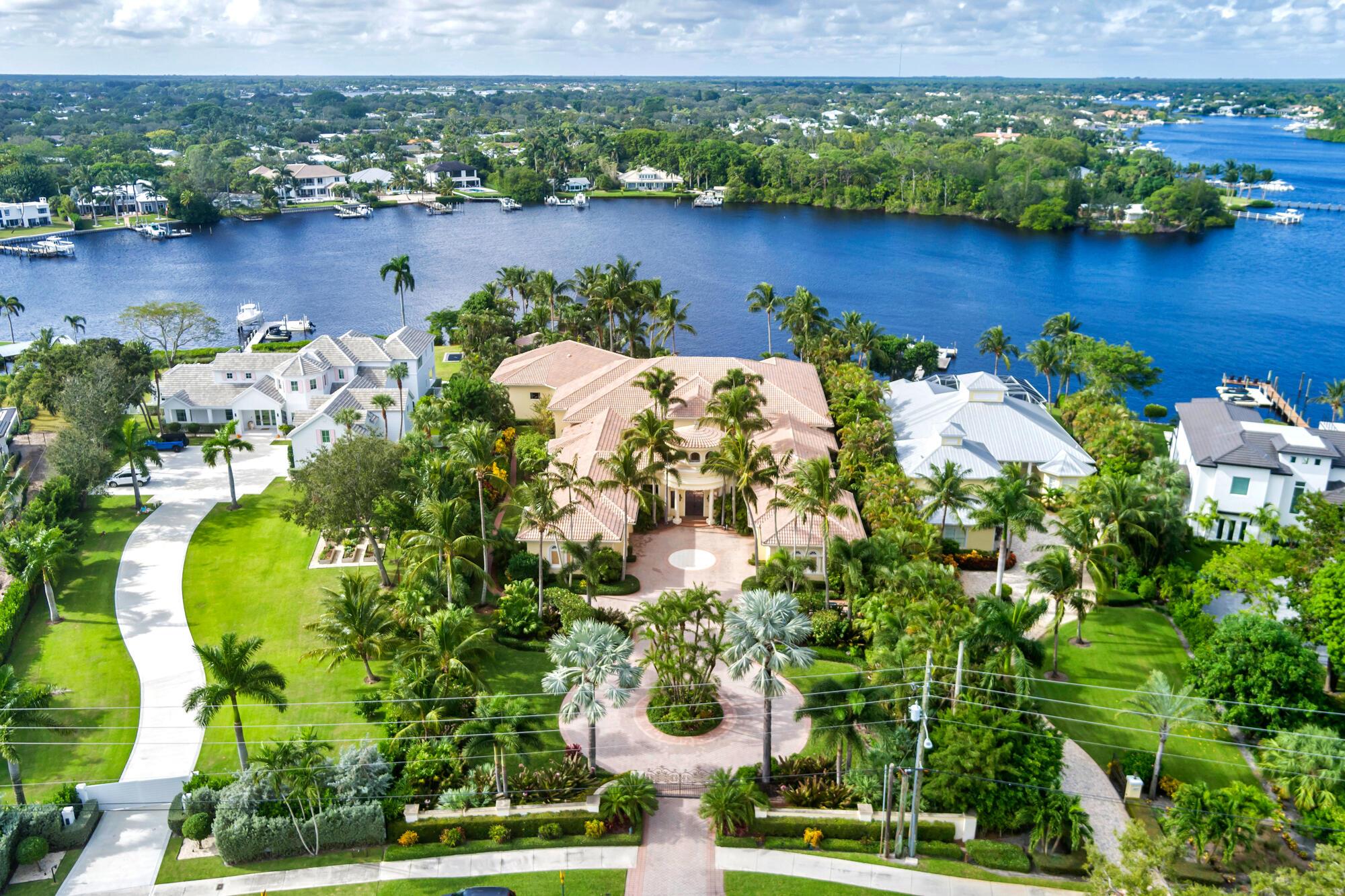 Hidden on the Loxahatchee River rests the most expansive, private waterfront estate in all of Tequesta. Boasting 130' of water frontage with pristine private westerly views of a protected river frontage in the distance. This glorious 17,000' single-story home is situated on a massive 52,000' lot. Featuring 5 spacious bedrooms, 5+ bathrooms, a 5 car garage (with a 6th AC'd storage bay,) a sprawling resort-style covered patio with grato-like swimming pool, a detached concrete block gazebo, a separate boathouse & a covered boat lift. The magic of this property is everywhere but it begins at the grand courtyard entry. With colossal iron/glass entry doors, the home was designed with entertaining and privacy in mind. The Loxahatchee River and pool are the perfect backdrop to every common area area as well as the primary bedroom and office suites. 
Close to amazing dining both by water or by car. This home is minutes to the Jupiter inlet, premier waterfront dining, shopping &amp; in close proximity to top private &amp; public schools, golf courses, country clubs and much more.