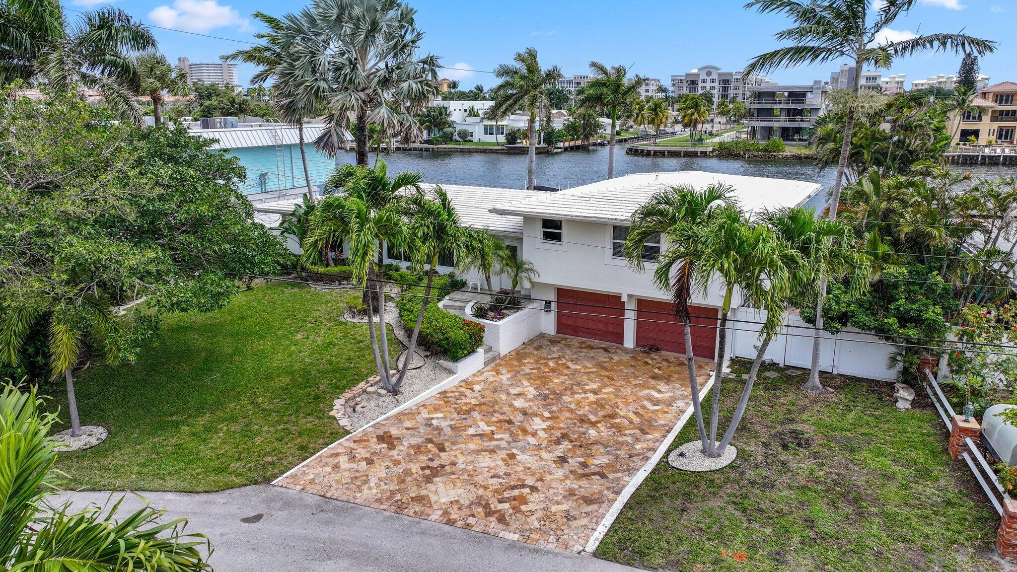 Introducing an extraordinary opportunity to own a rare direct point intracoastal waterfront property featuring 105 feet of pristine waterfrontage in one of the most vibrant and sought-after locations The Cove has to offer. This is not just a piece of prime real estate--it's an invitation to a lifestyle that only those who call The Cove home can truly understand and appreciate. Conveniently located just steps from The Cove Shopping Center, this property is surrounded by renowned attractions, including The Cove Waterfront and Tiki Bar, a beloved destination where boaters dock to enjoy delicious food right on the water. Just over the bridge, just over a mile away, you'll find the sands of the award-winning Deerfield Beach, a destination that attracts visitors from around the globe. Enjoy breathtaking ocean views from the iconic Deerfield Beach International Fishing Pier, alongside additional local favorites like JB's on the Beach and Oceans 234. Living in The Cove means embracing a vibrant community filled with activities and attractions that make this lifestyle truly unique. This exceptional waterfront estate offers expansive eastern exposure views, perfect for savoring your morning coffee while watching the sunrise over the water. Whether you envision transforming this property into your own private retreat or building your dream waterfront showstopper, this is one of the most premium lots to hit the market in some time. Don't miss your chance to own a piece of paradise&#x14;this opportunity is one you won't want to let slip away!
