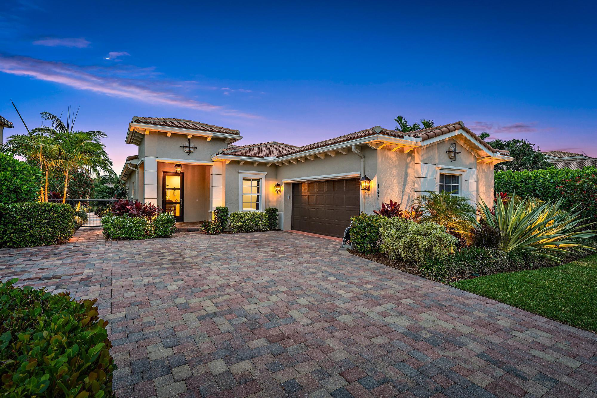 STUNNING, completely renovated CBS four bedroom, two and a half bath lakefront home in the highly sought-after gated community of Rialto in Jupiter! This meticulously updated residence offers just over 2,300 square feet of thoughtfully designed living space, featuring impact windows and doors, a split floor plan, and serene lake views with eastern exposure -- perfect for enjoying your morning coffee on the expanded travertine patio. With a wide green space in front, the home enjoys both privacy and tranquility, while also being just steps from the community pool and clubhouse.Step inside to a light-filled entryway that opens to a spacious formal living and dining area, accented with wide plank tile floors and elegant crown molding. Continue into the heart of the home where a completely remodeled chef's kitchen awaits, boasting top-of-the-line Thermador appliances, a built-in refrigerator, double oven, induction cooktop, and a custom vented range hood. The oversized quartz island, soft-close solid wood Shaker cabinetry, and floor-to-ceiling storage make this space as functional as it is beautiful.

Off the kitchen, the cozy family room invites relaxation with views through the sliding glass doors that lead out to the upgraded outdoor living area. The covered lanai features a stained wood ceiling, TV, Bluetooth speakers, Minka-Aire ceiling fan, and a picture frame screen enclosure &#x14; all overlooking the tranquil lake and lush landscaping beyond.

The spacious primary suite is privately tucked away and features a luxurious en-suite bath with new double vanities, quartz countertops, frameless glass shower, Toto toilet, and Moen fixtures. On the opposite end of the home, you'll find three generously sized guest bedrooms and two additional renovated baths, including a powder room &#x14; all designed with modern finishes and attention to detail.

Step outside to your own tropical retreat with an expanded travertine patio, professionally landscaped yard, and Volt landscape lighting to enhance the ambiance after sunset. The paver driveway has been widened for extra parking, and the two-car garage includes an epoxy floor and HyLoft ceiling storage racks.

Additional upgrades include: new solid wood doors, wide door moldings, 6" baseboards, new LED recessed lighting, Minka-Aire ceiling fans in every room, new custom closet shelving systems, new smoke and carbon monoxide detectors (2023), Hunter Douglas pleated shades throughout, new GE washer and Maytag dryer, and fresh exterior paint.

Rialto is a family-friendly, gated community zoned for top-rated Jupiter schools and offers resort-style amenities including a sparkling pool and kids' splash park, spa, fitness center, tennis and basketball courts, BBQ areas, and scenic walking trails.

Centrally located just minutes from Jupiter's beautiful beaches, world-class golf courses, shopping, dining, and easy access to I-95 and the Turnpike.

Don't miss the opportunity to make this turn-key lakefront home yours &#x14; schedule your private tour today before it's gone!