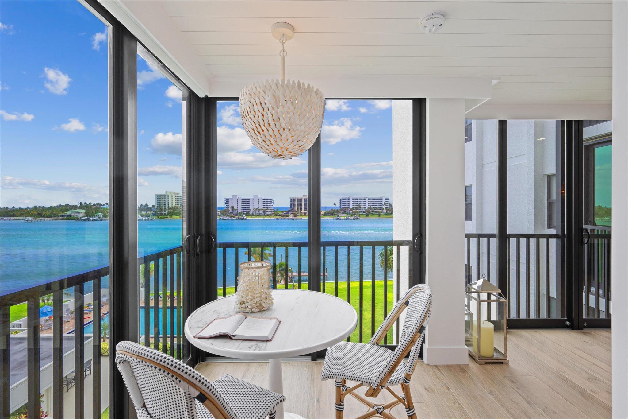 Newly renovated to perfection with spectacular panoramic views of the blue water on the Intracoastal and ocean! Don't miss this move in ready stunner with beautiful new porcelain floors throughout, new kitchen that was opened up and flows into the great room that overlooks the Intracoastal. The condo features raised ceilings, shiplap, all new impact sliders and windows, new wetbar, split floorplan with 2 master suites and an oversized walk in closet, luxurious bathrooms, all new doors and hardware and impeccable decor and furnishings! Sandpointe Bay is in the heart of Tequesta directly on the Intracoastal that offers wonderful of amenities, including  heated resort type pool directly overlooking the Intracoastal and Day, clubhouse, sauna, tennis, pickleball, kayak storage, fitness center!
