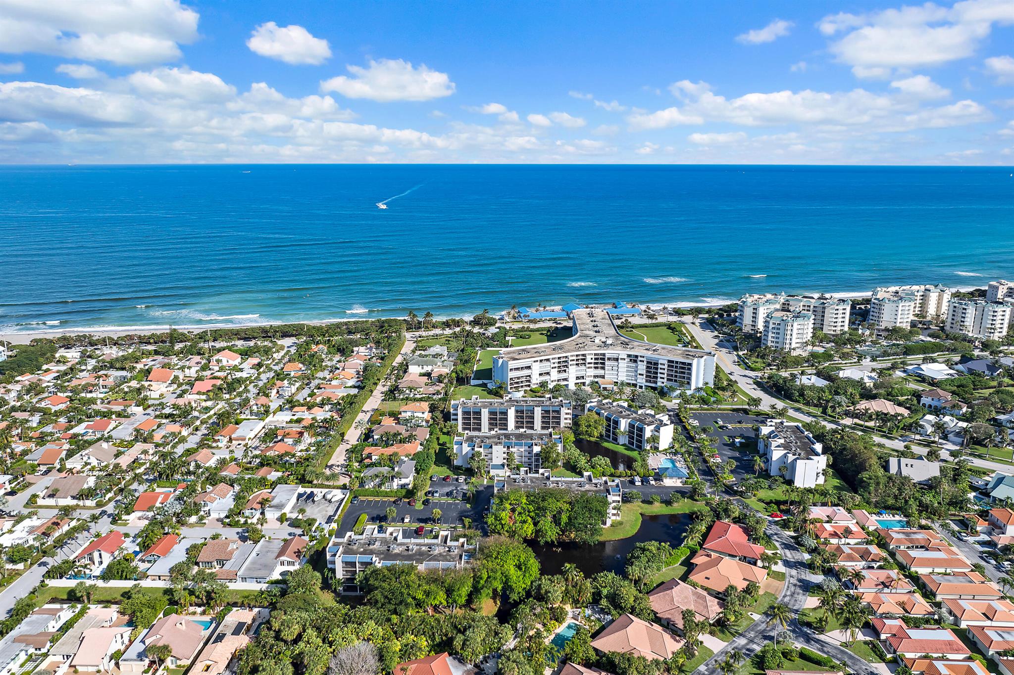 Located in Jupiter Ocean & Racquet Club, this 935 sq ft 1-bedroom, 1.5-bath condo offers an updated and move-in-ready coastal living experience. Recent enhancements include a completely refreshed kitchen featuring refaced cabinetry, quartz countertops, and stainless steel appliances. The open living area includes a new sleeper sofa and an added bar with beverage center, providing flexibility for both daily living and entertaining. The home showcases luxury vinyl flooring throughout, a walk-in shower in the upgraded full bath, refreshed vanities in both bathrooms, and a spacious walk-in closet in the bedroom. Other functional upgrades include impact windows and sliders, a 2021 roof, 2021 AC, and a 2019 water heater. Enjoy your morning coffee on the peaceful, north-facing patio or take a walk through the beautifully landscaped community. Amenities include two pools, a clubhouse, and patrolled security. The unit includes in-unit laundry and assigned parking. Just a short walk to Jupiter's iconic beaches and the scenic Riverwalk Trail, this condo is perfect for those seeking a well-maintained property in a prime location. Pet-friendly (up to 35 lbs).