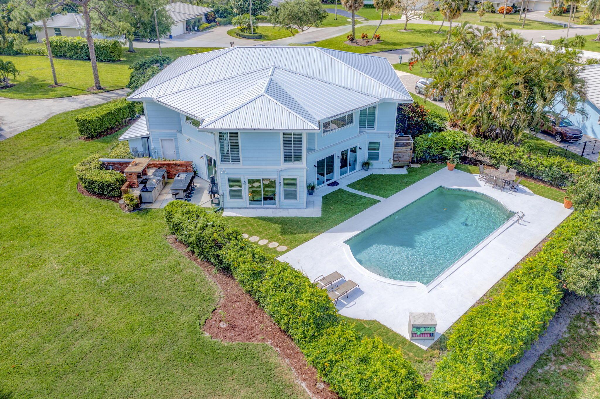 This One of a Kind Fully Renovated 5 Bedroom, 4 Bath Pool Home w/an Extended 4-Car Garage Offers 4,710 Living Sq Ft on over 1/3 of an acre, Backing Directly onto the Prestigious BallenIsles Golf Course. The Property Provides Unmatched Privacy, Lush Views & NO HOA's. Tucked away on a Spacious Cul-de-Sac Lot, This Home has been Thoughtfully Updated Throughout, Including a New 2024 Metal Roof, New AC units, Upgraded Electrical & Plumbing Systems. The 1st Floor Open Concept Features a Gourmet Kitchen w/Large Island that Seats 6, a 5-Burner Gas Cooktop, Double Wall Ovens & Fully Equipped Butler's Pantry. The Adjacent Dining Area & Oversized Living Room Include Shiplap Ceilings & Large Bar w/Refrigerator & Wine Cooler, all w/access to the Pool, Patio, & Summer Kitchen. A Full Bath w/Frameless.. Glass Shower is Conveniently Located on the Main Floor, Along with Laundry Rooms on Both the 1st &amp; 2nd Floors, Each Offering Plenty of Storage. Quartz Countertops Add a Touch of Elegance Throughout the Home. Upstairs, the Master Suite is a Private Retreat Featuring a Boutique-Style Custom Walk-in Closet with Built-ins, Abundant Storage &amp; a Spa-Like Bathroom Complete w/a Kohler Jetted Tub, Frameless Glass Shower, Extended Double Vanities, &amp; a Separate Linen Closet. The 2nd Floor also Includes a Generous Family Room, Office Space, Additional Storage Closets, &amp; 4 Guest Bedrooms, 1 w/a Built-in Murphy Bed along w/3 Full Baths.This Exceptional Home Seamlessly Blends Style, Comfort, &amp; Modern Upgrades in a Cental Location Making it a Rare Opportunity in Palm Beach Gardens. Conveniently Located Near Fine Dining, Shopping, Golf, Beaches, I-95 and the Airport.