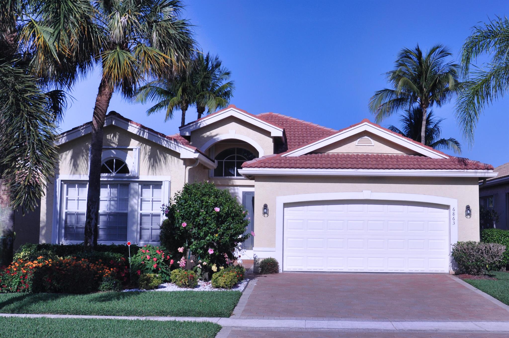 Enjoy a special lifestyle in Valencia Palm's luxury 55+ community! Perfectly functional layout and bright colorful walls throughout. Solid wood kitchen cabinets in a traditional style that is timeless.  Relax in the lovely setting of the extended screened patio, offering views of the serene lake. Experience the luxury of the clubhouse, complete with state-of-the-art amenities such as a fitness center, ballroom, card rooms, captivating shows, vibrant clubs, resort-style pools, a cozy cafe, and facilities for pickleball and tennis enthusiasts. Centrally situated, provides convenient access to pristine beaches, premier shopping destinations, and the vibrant Atlantic Ave. in Delray. Come immerse yourself in the epitome of refined living!New A/C in 2022 and water heater in 2021.MUST SELL!