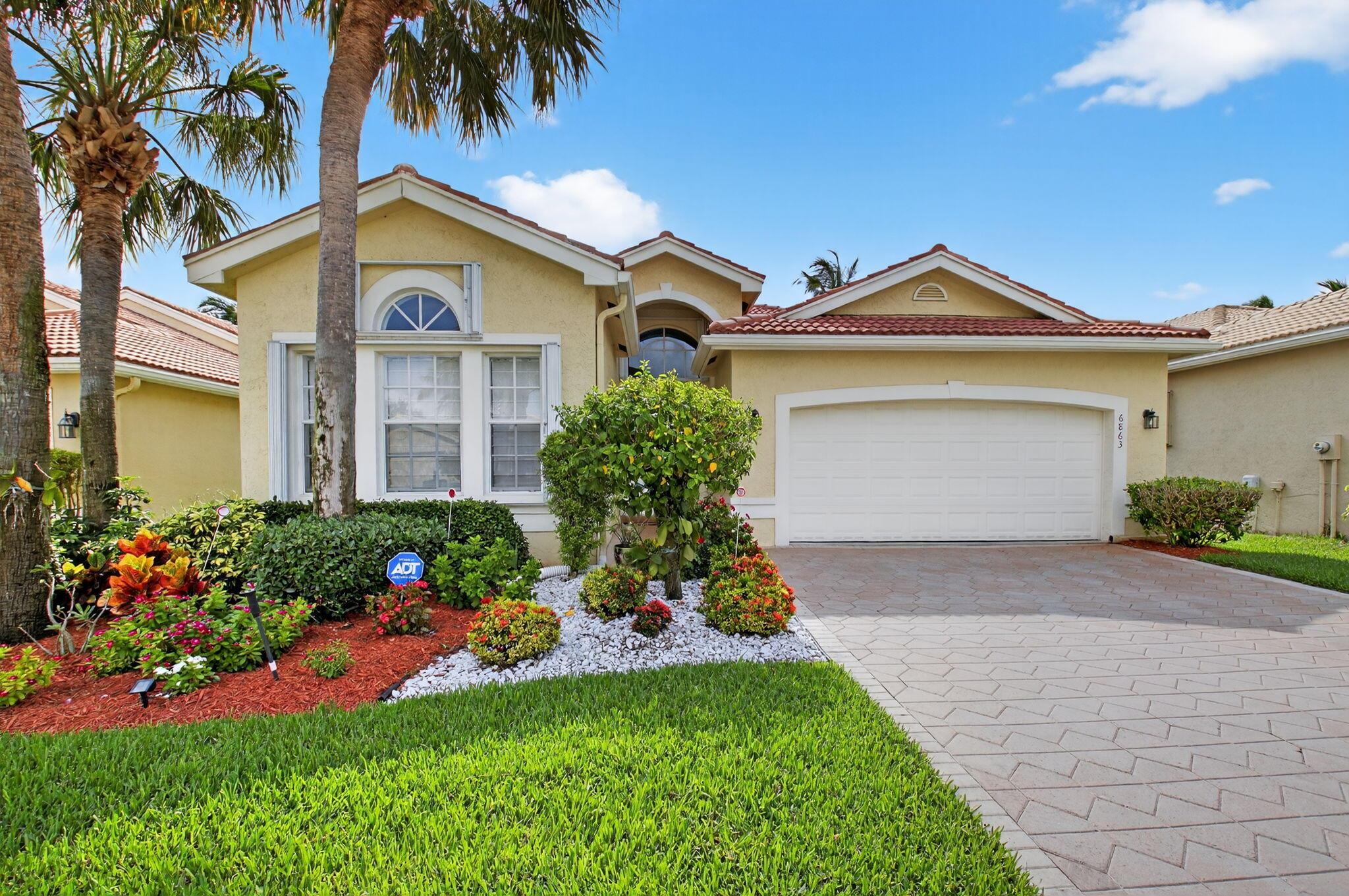 Enjoy a special lifestyle in Valencia Palm's luxury 55+ community! Perfectly functional layout and bright colorful walls throughout. Solid wood kitchen cabinets in a traditional style that is timeless.  Relax in the lovely setting of the extended screened patio, offering views of the serene lake. Experience the luxury of the clubhouse, complete with state-of-the-art amenities such as a fitness center, ballroom, card rooms, captivating shows, vibrant clubs, resort-style pools, a cozy cafe, and facilities for pickleball and tennis enthusiasts. Centrally situated, provides convenient access to pristine beaches, premier shopping destinations, and the vibrant Atlantic Ave. in Delray. Come immerse yourself in the epitome of refined living!New A/C in 2022 and water heater in 2021.MUST SELL!