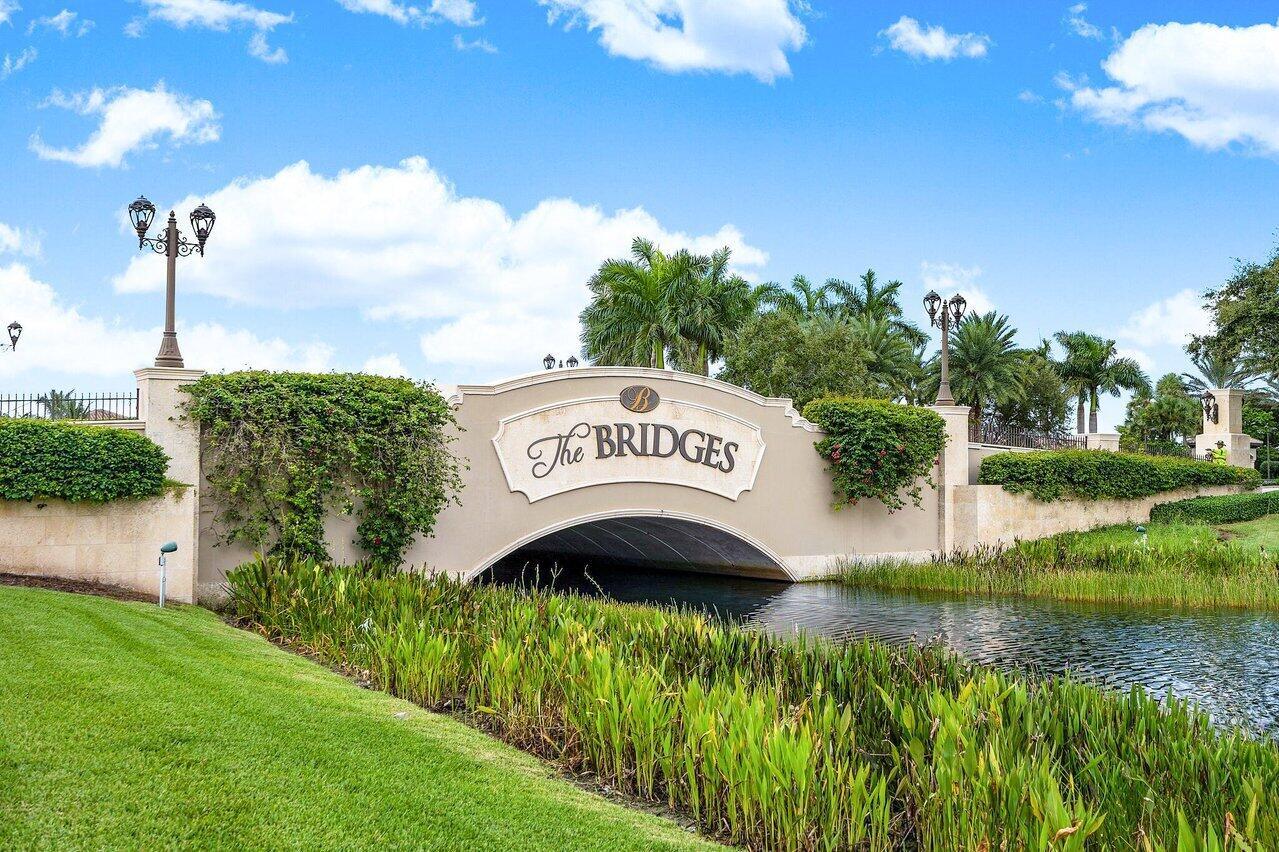 EXQUISITE LUSHLY LANDSCAPED LAKEFRONT RESIDENCE IN THE PRESTIGIOUS BRIDGES COMMUNITY!  THIS METICULOUSLY MAINTAINED & UPGRADED 5 BEDROOM PLUS OFFICE, 5 FULL & 2 HALF BATHROOMS, A CHEF'S KITCHEN WITH HIGH END VIKING & SUB ZERO APPLIANCES IS OPEN TO A LARGE FAMILY ROOM WITH SOARING CEILINGS! THE PRIMARY SUITE, OFFICE & GUEST BEDROOM ARE ON THE MAIN LEVEL. THE MINUTE YOU STEP THROUGH THE DOUBLE DOOR ENTRANCE INTO THE FOYER A LIGHT FILLED TWO STORY GRAND LIVING ROOM WITH VIEWS OF THE POOL & AN EXPANSIVE LAKE SETS THE STAGE FOR THE AMAZING FLOOR PLAN THAT ALLOWS EVERYONE PRIVACY & SPACE! THE BRIDGES CLUBHOUSE OFFERS A LIFESTYLE FOR ALL AGES WITH OVER 17,000 SQ FT OF UPSCALE AMENITIES! TENNIS, PICKLEBALL, FITNESS, A RESORT STYLE POOL, DINING POOL SIDE OR INDOOR/OUTDOOR SERVICE ARE JUST A FEW!