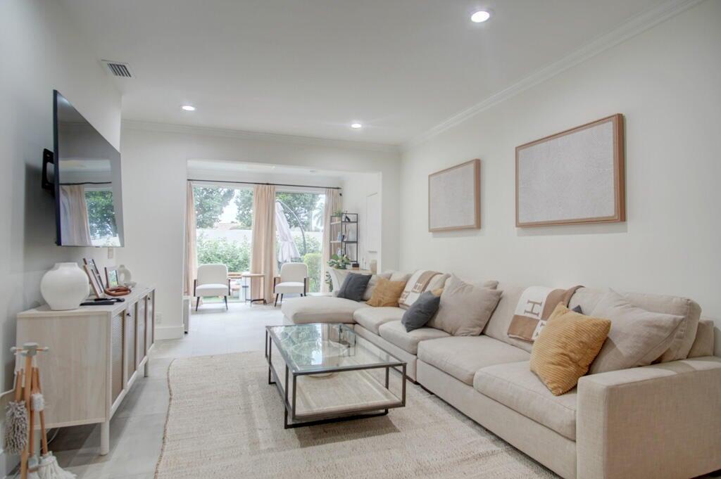 Stunning, spacious townhome, offering over 2,000 sq ft of elegant living space in the prestigious gated community of Boca Pointe. This 3 bedroom, 2.5 bathroom residence has been beautifully updated with high end finishes and a modern touch throughout. Step into the light and bright interior featuring an open floor plan. Floor to ceiling sliding glass doors invite an abundance of natural light. Enjoy the beauty of no carpet throughout, just sleek modern flooring throughout. Places of worship within walking distance. 24 hour manned gated community.