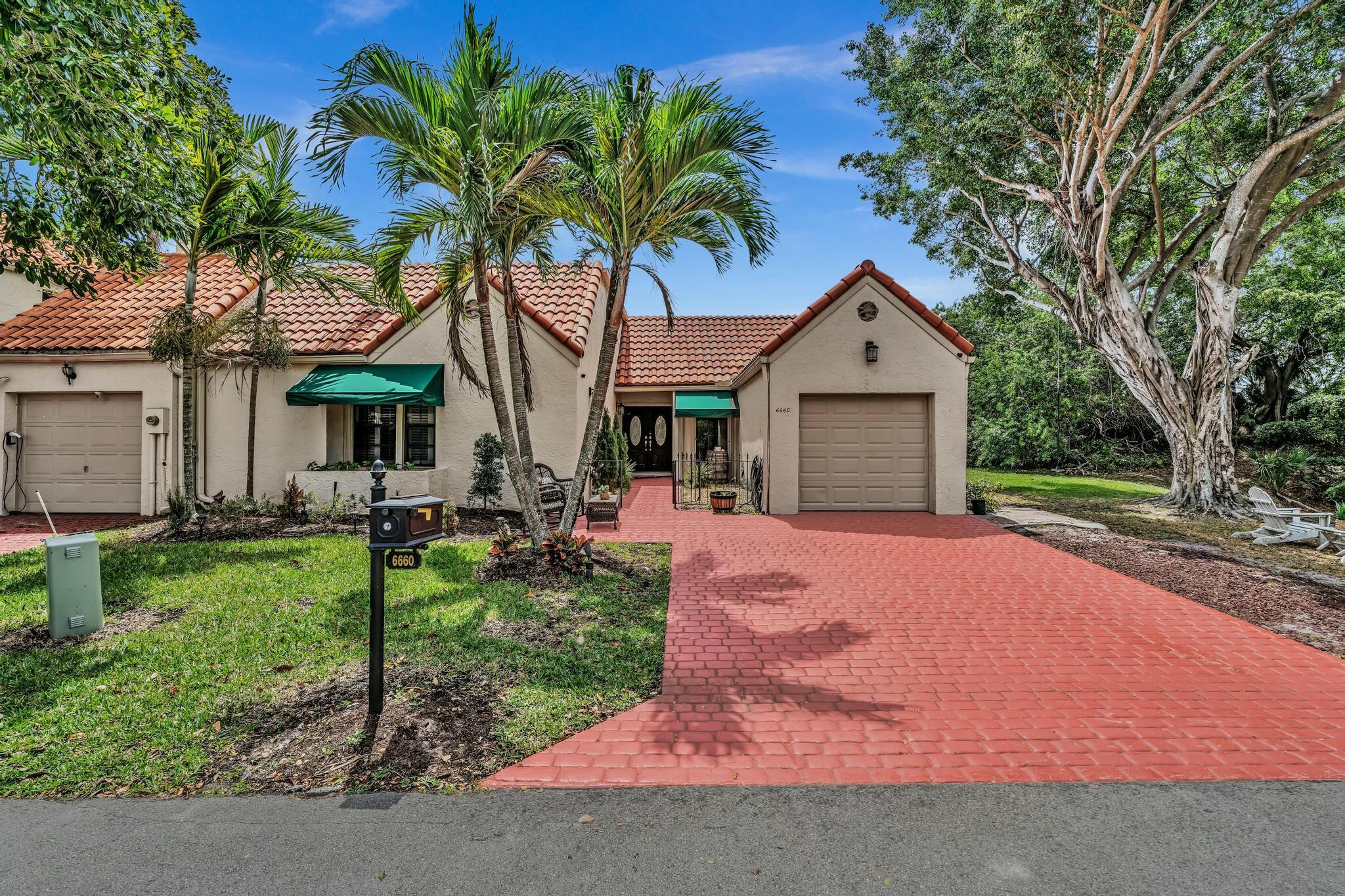 Adorable 3/2.5 one story Villa in the best location in L Ambiance in Central Boca. This spacious corner unit sits on an amazing lot overlooking a lovely lake. Beautiful updated kitchen with separate breakfast area & additional dining room. Very roomy living area. Roof 2016, New electrical panel 2024, Accordion shutters. Laundry room. Laminate flooring through main living areas. Plantation shutters, 2 outdoor patio areas. Primary bedroom has a large walk in closet, dressing area. Main bath with soaking tub, walk in shower & double sinks. One car garage & at the end of a Cul De Sac that allows for extra parking & tons of privacy. Walk to Verde elementary! Community has tennis & several pools. This hidden gem is a prime location in Boca. Mins to Town Center Mall & lots of great restaurants!