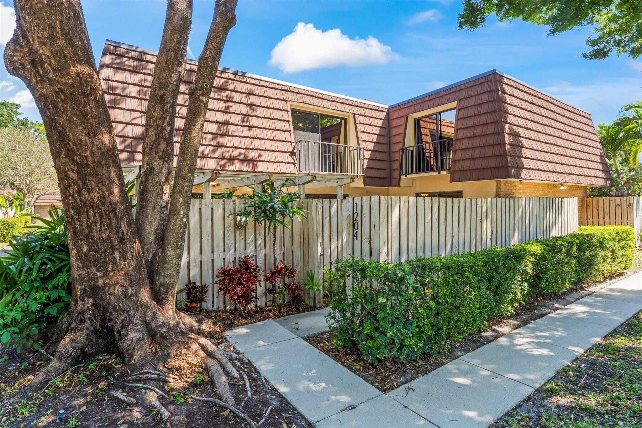 Cozy townhome in the heart of a vibrant city! Updated townhouse situated among mature trees and lush green space welcomes you home. Spacious corner unit +/-1,600 SF with a new roof (2023), features an extra large privacy fenced patio perfect for entertaining or BBQ's. Inside, there are new tile and vinyl floors, with 4'' baseboards, and fresh paint. Unit features a new, bright, white kitchen with lots of cabinets and counter space, and a stainless steel refrigerator, microwave, and dishwasher. Ample storage both downstairs and in bedroom closets. Property is pet friendly with dog walk stations and there's no size limit for dogs.Property amenities include a park, playground, tennis/pickleball, racquetball, basketball courts, and walking/exercise trail. The community encompasses what Palm Beach Gardens is all about, beautiful lakes and water features, large mature trees, and vast green space. Property management is on-site.

Situated between I-95 and the Turnpike at the corner of PGA Boulevard and Military Trail, access to northern and southern areas of Palm Beach County are unmatched.

Property is conveniently located in walking distance to Publix, CVS, and tons of restaurants and shops. Beach is a short 4 mile drive away, and approximately 14 miles to the Palm Beach Int'l Airport.