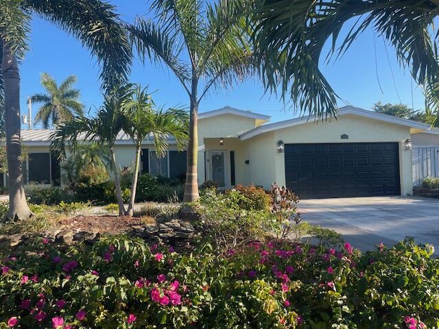 Experience the Best of South Florida Living- Ideally located east of Federal Highway and just minutes from the beach, shopping, and dining, this beautifully renovated home offers nearly 2,000 square feet of living space.  Traditional 2-bedroom split floor plan with a versatile BONUS ROOM perfect for a home office or third bedroom. The backyard is private, featuring a refinished pool (2019) with new pavers, pool pump and covered gazebo. The home is built for peace of mind with metal roof (2009), full impact windows and doors and newer AC system. New flooring throughout, plantation shutters, updated kitchen, air-conditioned 1.5 car garage, side year for boat/RV storage, indoor laundry, circular drive and generator plug for easy whole house hookup. Owner/Agent