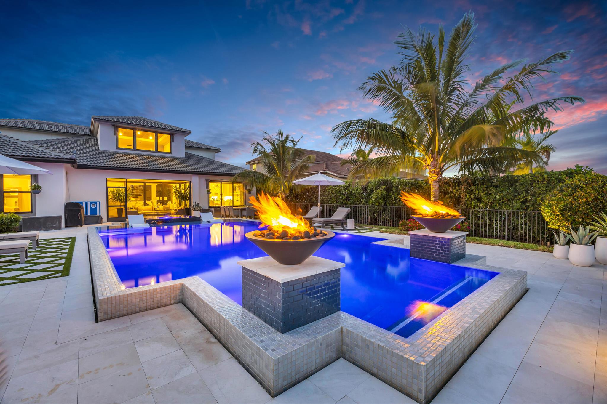 Owner is a Florida licensed real estate agent.  Welcome to your new move-in ready designer home in the heart of Jupiter's premier gated and family-friendly community of Sonoma Isles. This residence sits on a beautiful, oversized Cul de Sac lot with exquisite tropical landscaping and an award-winning designed saltwater pool/spa, the largest in the community.As you step inside the soaring 2-story foyer, you will be greeted by tons of natural light in this open-concept living space filled with designer/luxury upgrades, features (custom built-in wall unit, molding, trim, wallpaper, beams etc.), and furnishings.  This home comes completely furnished.  This part-time/lightly lived in home is the much sought-after Garden Vista model boasting four bedrooms (primary on the first floor) five and a half baths, including a full cabana bath, an office, and a spacious loft. The home is perfectly situated on a private and tranquil lakefront lot with long lake views as well as views of an uninhabited island preserve that is home to a wide variety of Florida's beautiful native birds.
The kitchen in this home is a chef's delight with its multitude of solid wood cabinets, quartz countertops, top-of-the-line stainless steel appliances, and an expansive eat-in island with a 3-inch quartz waterfall countertop. The kitchen includes a reverse osmosis water purifying system--the home is equipped as well with a whole-house water softening and purification system. The kitchen flows seamlessly into the living room, dining room, bar area where you can gaze through the zero-corner glass sliding doors into a screened lanai and into the beautiful, lush and inviting backyard.
The primary bedroom includes an oversized sitting area with a huge picture window, bringing the beauty of outdoors inside, and includes a luxurious en suite bathroom and an adjacent laundry room. There is one guest bedroom on the opposite side of the home with its own en suite, as well as two additional bedrooms and full bathrooms upstairs, along with the loft, perfect for a family game/relaxation area.  

The boutique, gated community of Sonoma Isles boasts a multitude of community amenities, including tennis, pickleball, a clubhouse with a state-of-the-art fitness center, card room, and entertaining space, as well a resort-style pool, spa, fire pit, and children's playground.  Located in the highly sought-after town of Jupiter close to world-class restaurants, shopping, beautiful beaches, and Palm Beach International Airport, this home truly offers an unparalleled lifestyle.

Do not miss out. Schedule your private tour today.