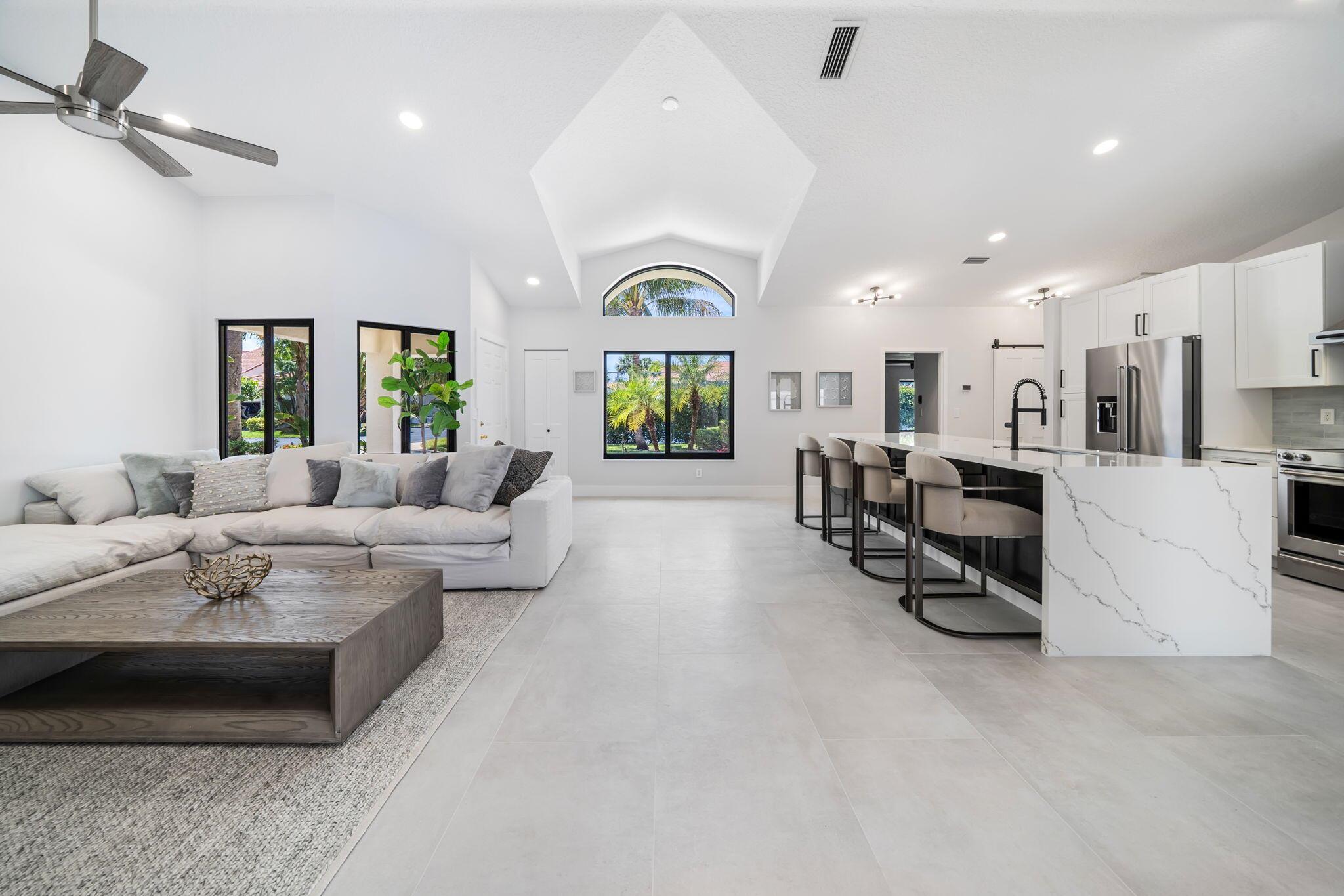 Live like you're in a single-family home in this stunning 3 bed, 2 bath, 1 story villa just minutes from Juno Beach and the ocean! Completely renovated in 2025, this spacious home features; oversized 24x48'' porcelain tile, new modern baseboards and interior doors; impact windows, a private pool with new marble decking (new pool pump) and a rare two-car garage. Enjoy sleek finishes, open-concept living, and seamless indoor-outdoor flow perfect for entertaining. The modern kitchen boasts top-tier appliances, 10 ft island with double waterfall edge quartz counters. While each bedroom offers privacy and comfort, both redesigned bathrooms exude luxury and provide a serene, spa-like retreat. Located in the quiet, upscale community of Sea Oats; close to shops, dining, and coastal charm.