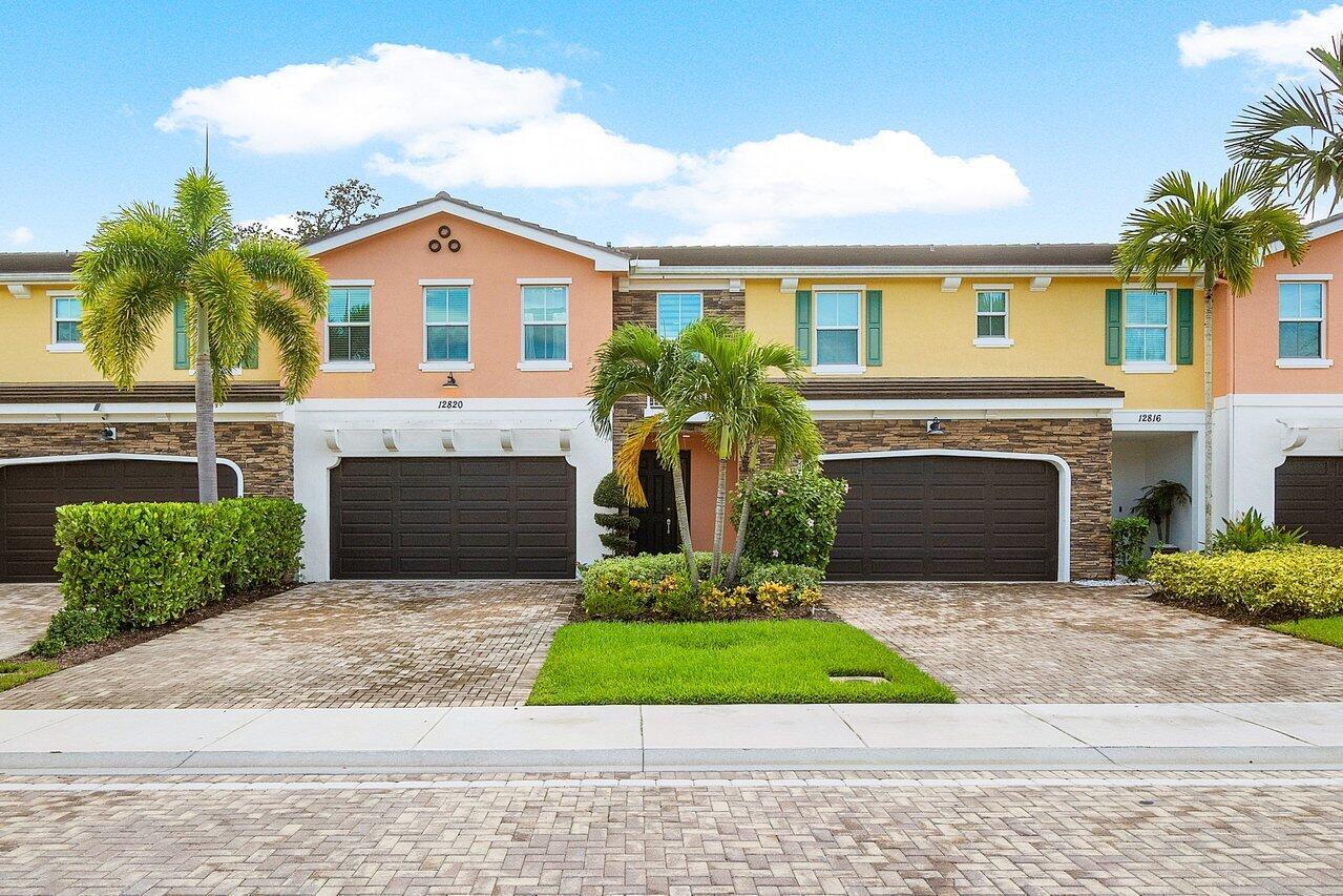 Trevi Isle is the best kept secret in Palm Beach Gardens! This exclusive enclave features just 50 luxury townhomes with a modern, contemporary design and high-end finishes throughout. Enjoy peace of mind with full impact hurricane glass and a layout designed for today's lifestyle.Offering 3 spacious bedrooms, 2.5 baths, plus an open loft perfect for a home office or flex space, this home has it all. You'll love the 20'' porcelain tile floors in the main living areas and the gourmet kitchen featuring 42'' cabinets, a large center island, and stainless steel appliances--ideal for both everyday living and entertaining.Step outside to your private, preserve-view patio--a peaceful space to unwind or host a small gathering. The gated backyard adds an extra layer of privacy. Located just steps from the community's heated pool, and with ample guest parking, this home offers convenience and comfort. Plus, it's just minutes from all the premier shopping, dining, and entertainment that Palm Beach Gardens has to offer.