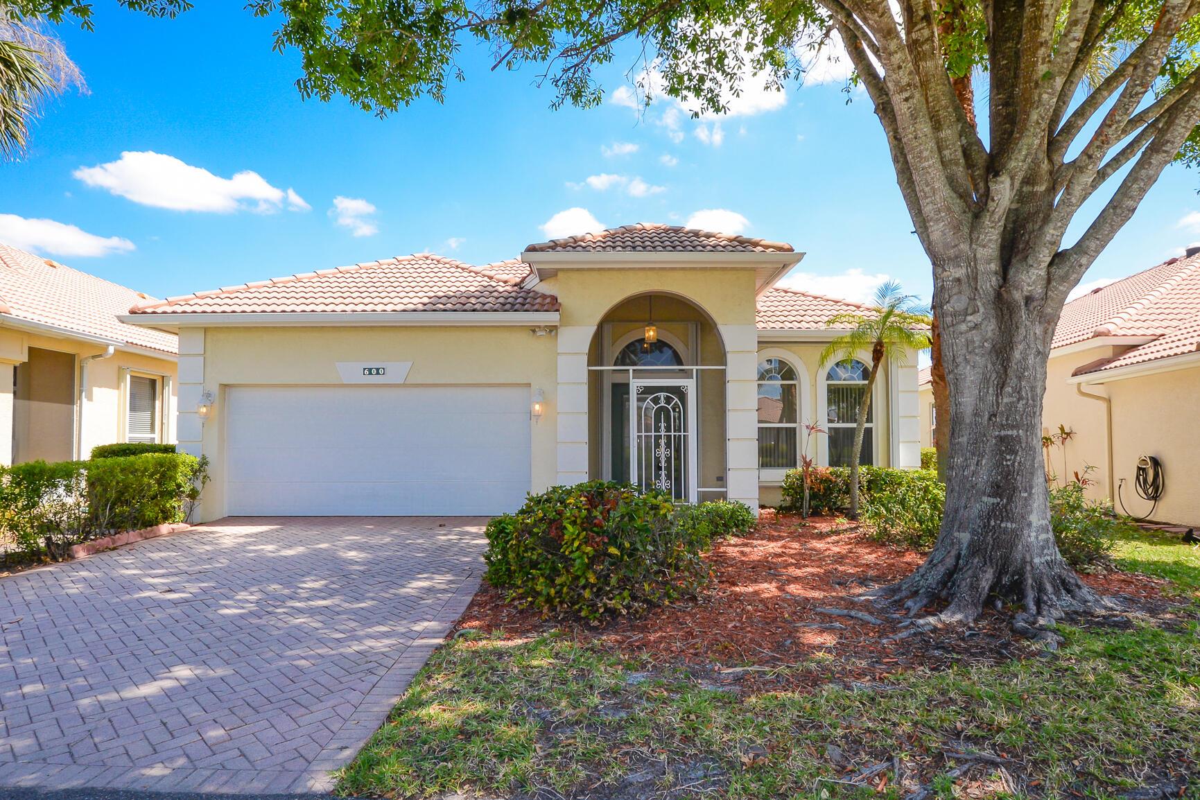 Beautiful Cambridge Model in ''Isle of Capri'' at ''Kings Isle'', fabulous 55+ community in the heart of St Lucie West (A planned Community). Features CBS Construction, Barrel Tile Roof, Decorative Driveway, Covered Patio, freshly painted interior & Move in condition. Hosts 2 Bedroom's, 2 bath's, Den & 2 Car Garage. Spacious Screen enclosed Lanai with beautiful Lake View. Details include Volume Ceilings, Tile & new carpet, open eat in Kitchen with White Cabinets, pantry & NEW Stainless steel appliances. Split Floor Plan, large Master Suite includes walk in closet. Updated A/C - 2023, Accordion shutters, water heater 2017, new electric panel & Laundry room. HOA fee's include Manned gated security, lawn care, cable, internet & The Royal Club offering something for everyone. The Royal clubhouse includes:  exercise room, card room, craft room, ball room, tennis, pickleball, billiards, entertainment, clubs, travel, resort style pool/Spa and More! St Lucie West is a planned community with new stores, restaurants, doctors offices, golf courses and even home of the NY Mets spring training. The Treasure Coast boasts about beautiful waterways and beaches with a fabulous location. Only 45 minutes from the Palm Beach Airport, Garden Mall &amp; 1.5 hours from Orlando going north and Ft. Lauderdale going south.