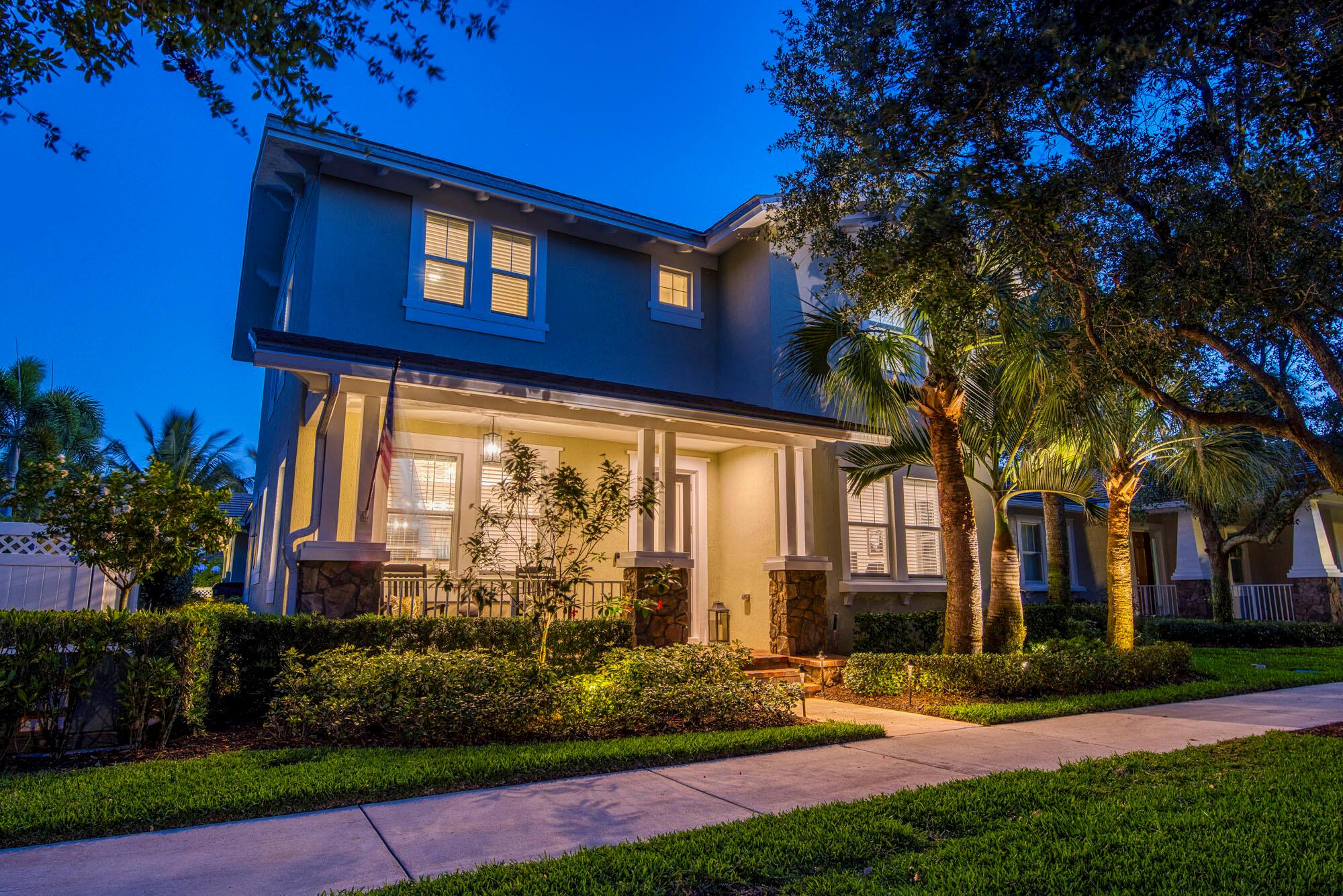 This stunning 4 bedroom, 3 bath + private office home is a beautifully updated gem in the highly sought-after community of Windsor Park at Abacoa. Spanning over 2,500 sq ft, this residence features a bright open floor plan with wood-look tile throughout, elegant crown molding, and custom finishes at every turn. The gourmet kitchen is the heart of the home, boasting white quartz waterfall countertops, stainless steel appliances (2022), a large center island, custom banquette dining, and a walk-in pantry. French doors open to a dedicated office, while the spacious great room flows seamlessly to a tropical backyard retreat.This is truly a next-generation smart home, fully integrated with Google Smart Home technology. Control everything from the coffee maker to the lights, AC, fans, locks, garage, pool jets, and more all from your phone or voice command. Every detail has been designed for modern living and effortless convenience. Outside, enjoy your own private oasis with a custom heated saltwater pool complete with sun shelf, fountains, and LED lighting. The covered lanai with TV hookup, turf-inlay patio, and lush landscaping make for the ultimate outdoor living space. Full impact glass, new AC, hybrid water heater, and an epoxy-finished 2-car garage with smart opener add both comfort and peace of mind. Windsor Park offers a resort-style clubhouse, workout facility, fire pit, and community pool, all just minutes from top-rated schools, shops, dining, parks, and Jupiter's beautiful beaches.