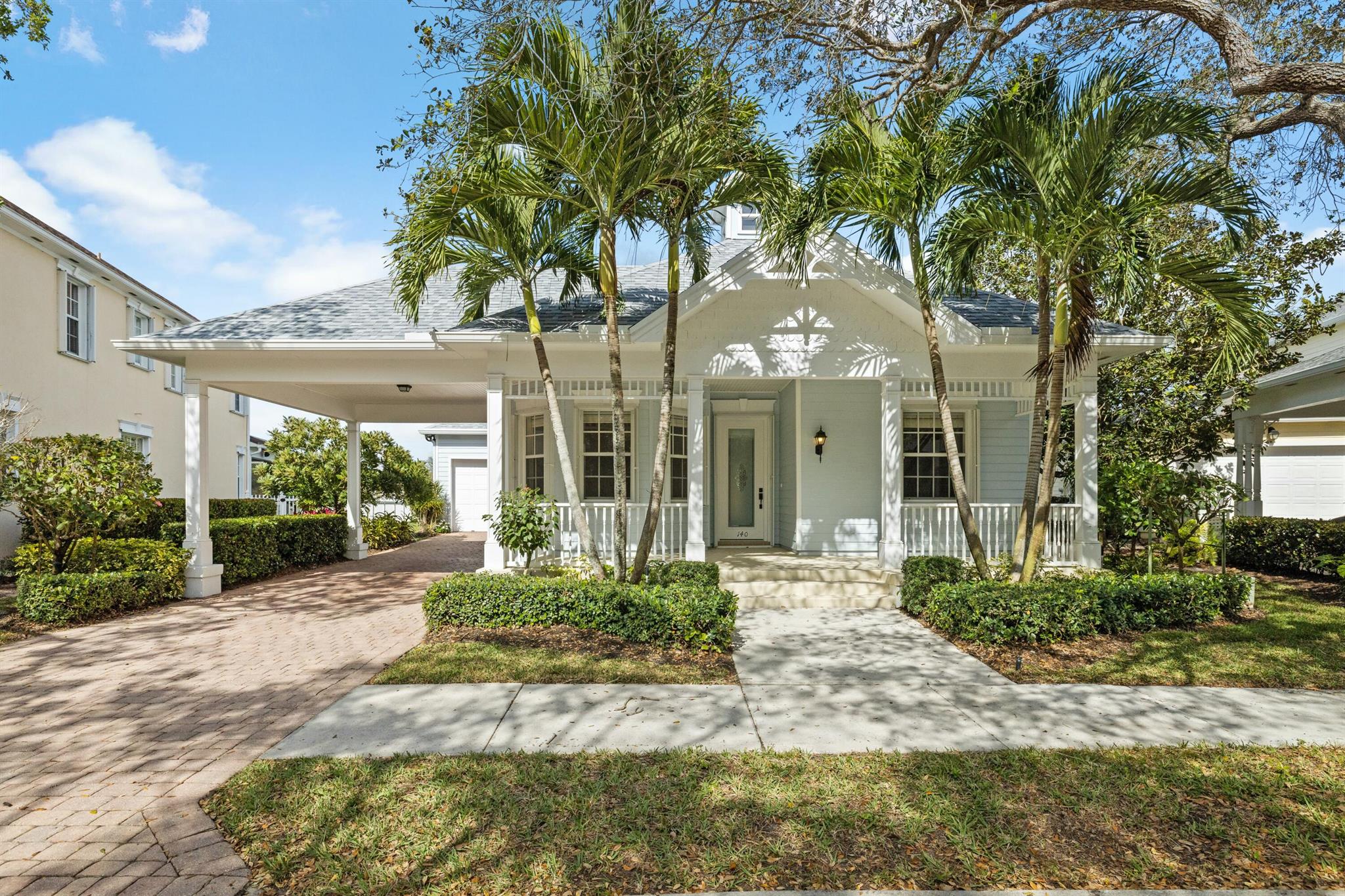 Sweeping water and golf views! Introducing the preferred single story model with a striking blue painted exterior--a true gem on the Island at Abacoa! This rarely available single-story home has a new roof and fully renovated interior and boasts 3 bedrooms, 2 baths, plus a den/office, and a 2-car garage. It also includes a primary master bedroom with sliding glass doors leading out to your large screen enclosed lanai, and a full walk in master bedroom closet. Enjoy the convenience of walking or riding your golf cart to the Abacoa Golf Club, community pool, restaurants, shops, playground, and more! Centrally located near I-95 and just minutes from Jupiter's beaches, this home truly has it all.