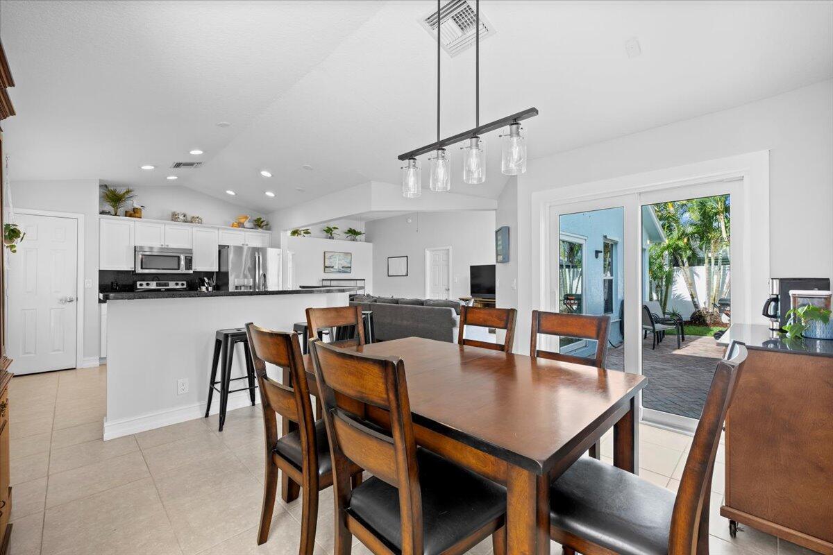Motivated Seller! This delightful CBS 3-BR, 2-BA home is perfect for those seeking comfort and style., and located in highly sought after Heights of Jupiter. Featuring freshly painted exterior and new Impact Sliders that open up to a private fenced-in yard, ideal for soaking up the Florida sun and entertaining. The kitchen features granite countertops, stainless GE appliances & newly painted white cabinets. The bedrooms boast durable vinyl flooring & home is equipped with panel shutters for storm protection. Recent updates include a roof replacement in 2023 and an A/C unit from 2016.  Inside laundry room w/ Samsung washer & Maytag dryer. Attached 2 car garage.  No HOA, community's amenities include a park/Picnic area, Minutes to I-95, Roger Dean Stadium