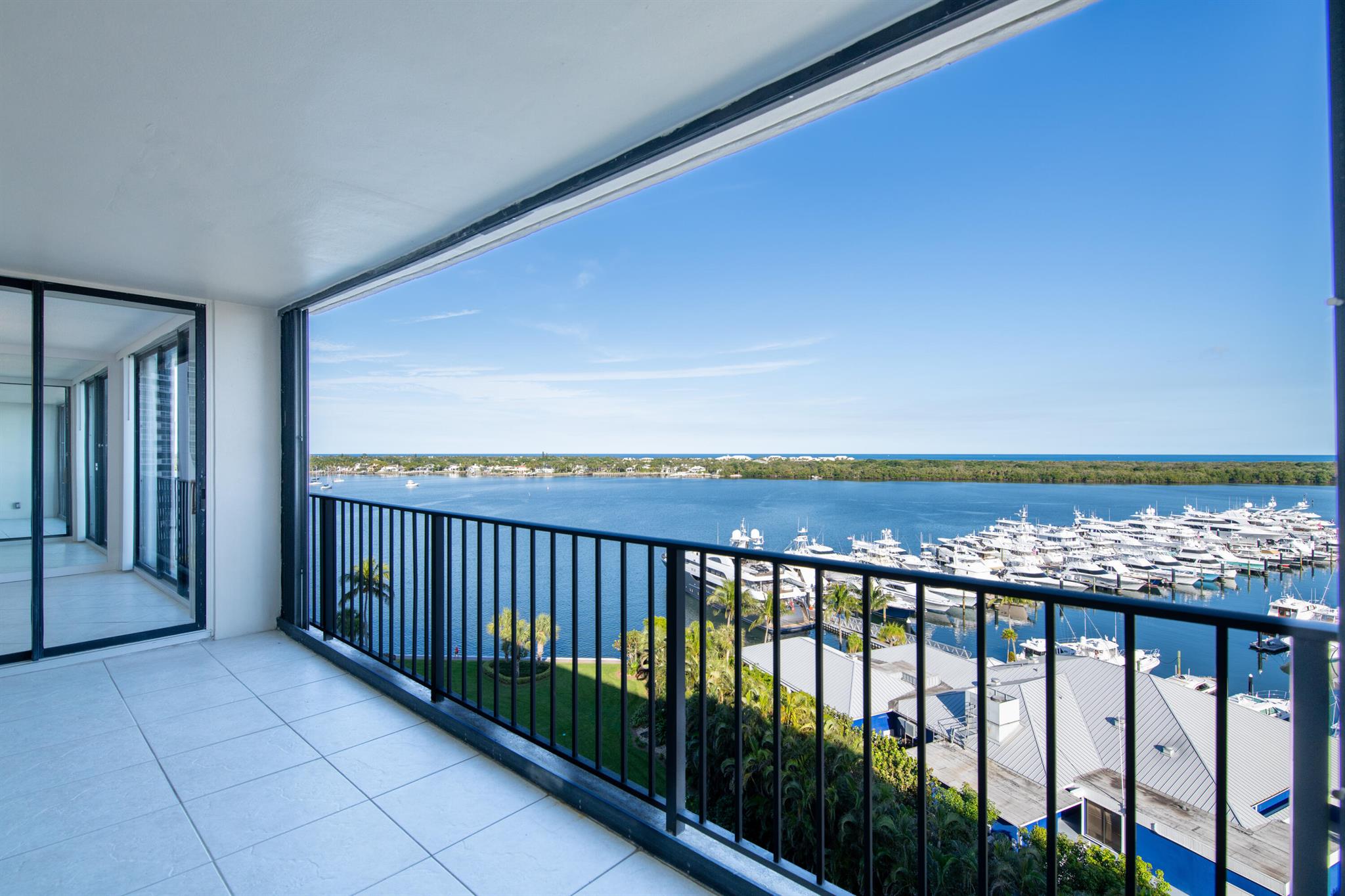 Rarely available, this 11th-floor condo at 122 Lakeshore Drive offers unparalleled, unobstructed panoramic water views in the prestigious gated community of Old Port Cove. This luxurious enclave overlooks the Intracoastal Waterway, ocean, marina, & yacht club, with convenient access to world-class golf courses, upscale shopping, theaters, white sandy beaches, & fine dining. This spacious 2br/ 2ba unit spans over 1,900 total sq. ft. & features upgrades like recessed lighting, freshly painted interiors, hurricane-impact sliding glass doors in the oversized primary suite, in-unit washer & dryer,& an expansive balcony with breathtaking water views. Residents enjoy resort-style amenities, including a pool, fitness center, large gathering room, and 24-hour manned gate, making Old Port Cove the