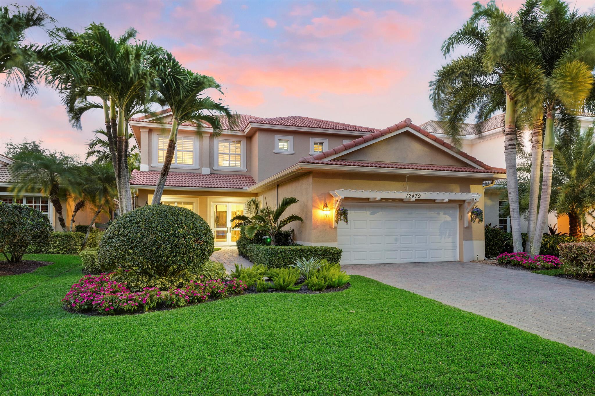 Luxurious Resort-Style Living in the Heart of Palm Beach Gardens! Step into this 2009 two-story Elisa model home, masterfully built by Kolter, nestled in the prestigious gated community of Paloma. Offering five bedrooms, an expansive loft, and heated saltwater pool, this residence combines functionality with unparalleled elegance. From the moment you approach the stunning landscaped entrance, you're welcomed by gorgeous mahogany double doors, leading into an oasis of sophistication. A 2-story formal living room, framed by a stunning hardwood staircase, greets you upon entering. The light-filled kitchen boasts custom cabinetry, new countertops, new designer backsplash, custom hood and wine storage, perfectly complemented by newer high-end Thermador appliances. A butler's pantry complete with a wine refrigerator elevates your entertaining game. This home epitomizes the perfect balance of indoor and outdoor living. Glide seamlessly from your spacious family room to an outdoor travertine pool deck, where new landscaping and all turf grass evokes the tranquil ambiance of a tropical oasis. Your modern saltwater pool with waterfalls, LED lighting, and a serene hot tub creates a retreat-like experience, perfect for reading, relaxation or entertaining.

The second floor presents a serene master suite, with a renovated master bathroom and large walk in closet with custom shelving. Adjacent to the master suite is a versatile loft area, ideal as a media or playroom, along with three additional bedrooms and two well-appointed bathrooms upstairs. Downstairs you will find a 5th room, currently being used as a bedroom, or perfect for a private office space or gym. 

Energy-efficient features like Trane AC units and Hunter Douglas plantation shutters further enhance your comfort. Other upgrades include a full home generator, impact glass windows and doors, all new high-end lighting and fans, beautiful crown moldings - and trey ceilings complete this perfect package.

Living in Paloma, you gain access to a resort-style clubhouse with a fitness center, pool, playground, and serene park settings - all just moments from Downtown Palm Beach Gardens, PGA Boulevard, and the area's world-class beaches. Just 25 minutes to PBI airport, incredible golf courses, access to boating, fishing, and all coastal water sports, this location simply can't be beat. The HOA fees of $1292/quarter include your basic cable and high speed internet, landscaping, security gate, all community amenities, ADT home security system, management, reserves &amp; irrigation. Don't miss your opportunity to make this stunning and immaculately maintained home your own.