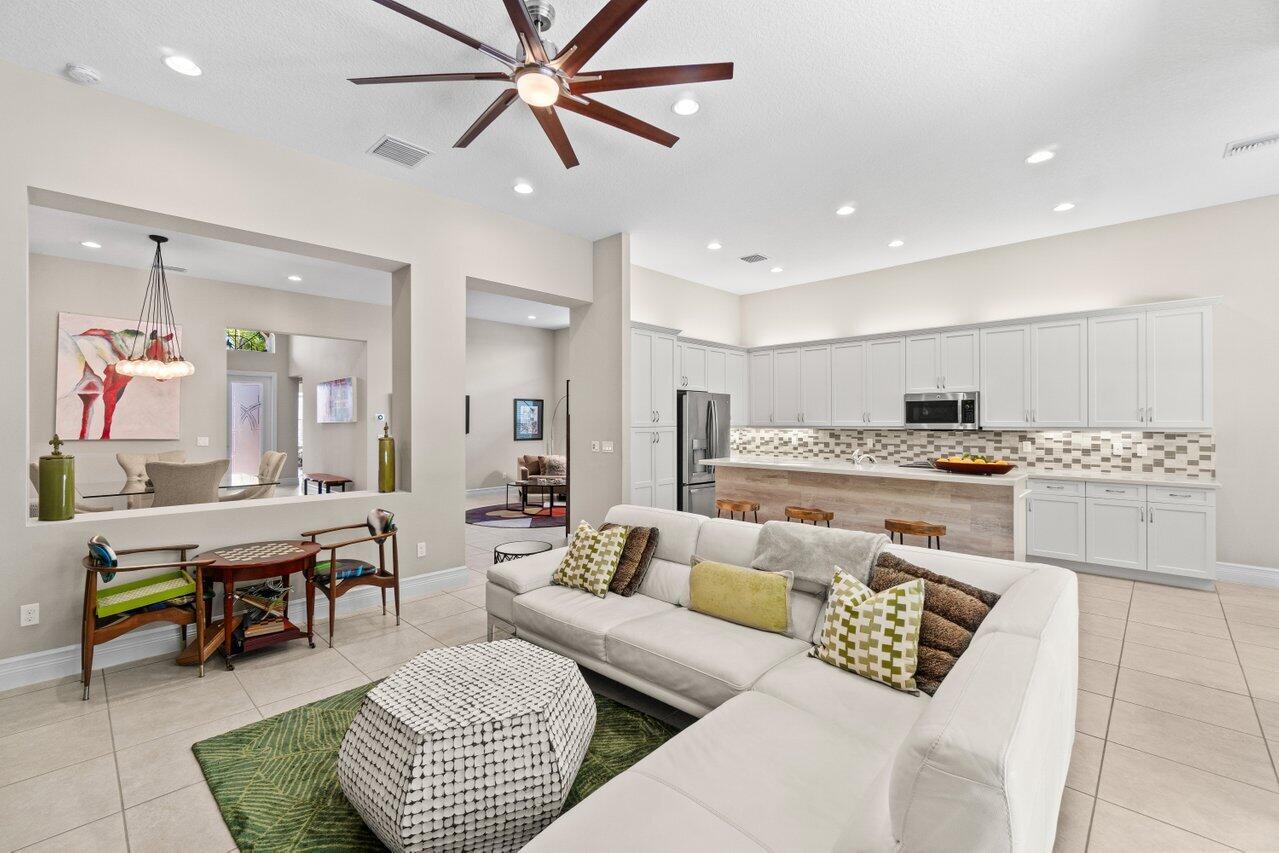 Welcome to this beautifully sought-after upgraded Gilbralter model home in Valencia Cove, offering exceptional style, comfort, and convenience. Valencia Cove.This meticulously maintained home blends luxury with functionality and is designed to impress from the moment you arrive. Its glass front door creates a bright, welcoming entry.The gourmet kitchen features a high-end Bosch dishwasher and an exterior-vented exhaust fan, ensuring superior performance for your culinary endeavors. The new AC unit adds year-round comfort and energy efficiency.  The backyard oasis boasts extended pavers, lush turf inlays, and an electric patio screen, allowing you to enjoy the outdoors comfortably. Custom epoxy-coated garage floor with built-in shelving keeps your storage organized and  a 120v outlet. Perfect for entertaining or simply unwinding in privacy, the spacious bedrooms are elevated by transom windows and electric blinds, offering natural light and privacy at the touch of a button. 
Don't miss your chance to indulge in your desired lifestyle.. This is the perfect blend of comfort, luxury, and low-maintenance living.

Valencia Cove in Boynton Beach, Florida, is a premier 55+ active adult community for those seeking a vibrant, resort-style lifestyle.  This gated community offers luxurious single-family homes and an array of amenities tailored to active adults.
At the heart of the community is a 39,000-square-foot clubhouse, serving as the social and recreational hub. Residents can enjoy.
A state-of-the-art fitness center with yoga and aerobics studios
An indoor and outdoor caf+¬, a catering kitchen, and a demonstration cooking studio
Card rooms, a billiards room, and an arts and crafts studio with a kiln
A grand ballroom with a stage and dance floor for events and performances
Outdoor amenities include:
A resort-style pool, lap pool, resistance pool, and whirlpool spa
Har-Tru tennis courts, pickleball courts, and two bocce ball courts and much much more!!!
Valencia Cove offers an exceptional lifestyle for active adults seeking luxury, community engagement, and a wealth of recreational opportunities in a beautiful Florida setting