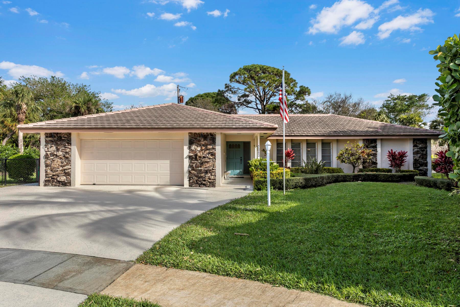 Welcome to a delightful gem nestled in the desirable Juno Isles community. This residence presents a spacious open floor plan, enhanced by a split-bedroom design for added privacy.Step inside to find low-maintenance wood laminate flooring throughout, and say goodbye to dated popcorn ceilings. The recently renovated kitchen boasts pristine white cabinets, granite countertops, and a welcoming island perfect for entertaining.Outside, discover a rarely found 20x40 swimming pool, accompanied by a large covered patio complete with a convenient pool bath. The property is set in a peaceful cul-de-sac and offers a private backyard with no rear neighbors.  The oversized 22x24 garage, with an additional 8x10 area  provides ample space for all your vehicles and recreational toys. Situated in unincorporated Palm Beach County, this home benefits from lower taxes. Enjoy the tranquility of suburban living while being in close proximity to local amenities and our beautiful beaches. The HOA is only $12 per month. This is not just a house, it's a lifestyle waiting for you to embrace it and make it your own