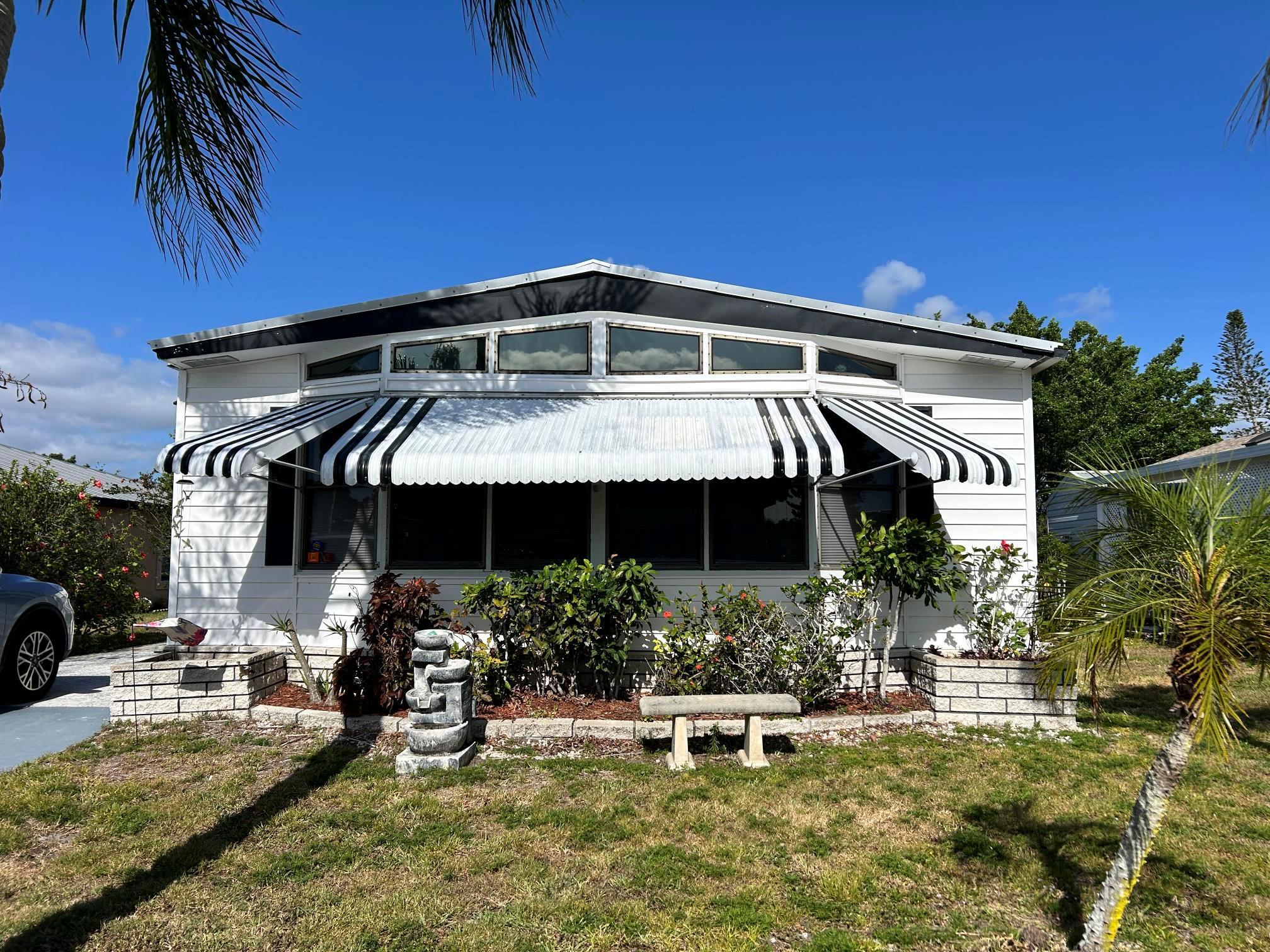 Turn-Key 2 Bed | 2 Bath Manufactured Home - Fully Furnished! Move right into this beautifully maintained 2 bedrooms, 2 bath manufactured home, perfectly set up for easy Florida living! This turn-key home is fully furnished and features laminate flooring throughout, making it both stylish and low-maintenance. Key Features: Spacious Island Kitchen with plenty of prep space and cabinetry, Comfortable Florida Room--great for relaxing or entertaining, Newer Metal Roof for peace of mind and long-lasting durability, Generous storage options both inside and out, Bright, open layout with tasteful furnishings include, This is the perfect home for snowbirds, full-time residents, or anyone looking for an affordable, move-in-ready home in a welcoming community.