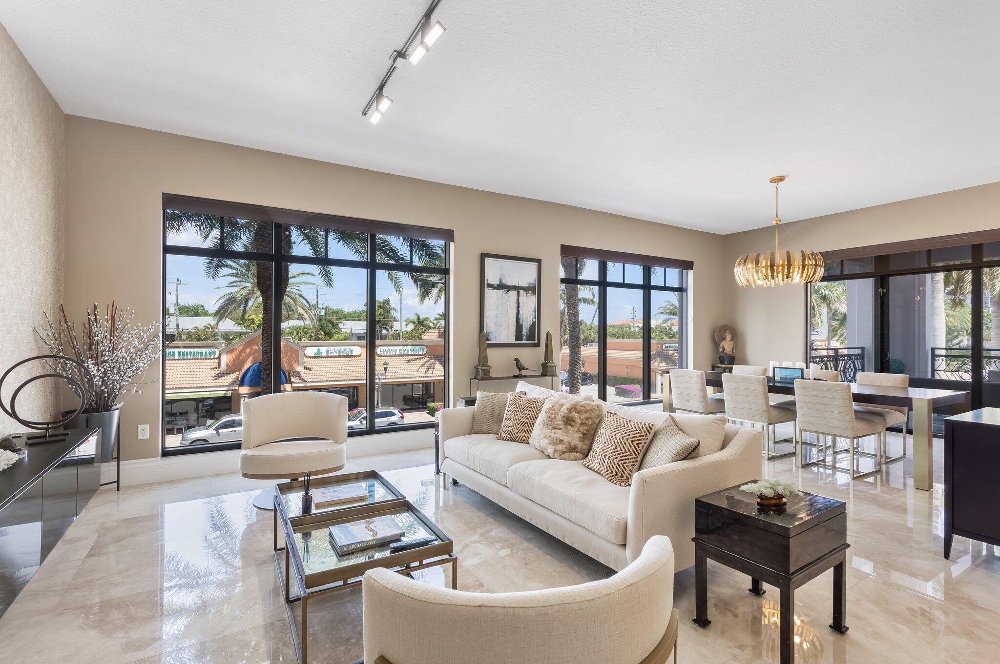 STEP INSIDE THIS ONE-OF-A- KIND, 2-LEVEL RESIDENCE WITH OVER 3,200 SQ/FT BOASTING A CHIC NY FEEL FROM THE MOMENT YOU WALK IN. THIS 3 BEDROOM |  2.5 BATH 2ND FLOOR/CORNER UNIT COMES WITH A PRIVATE INTERIOR ELEVATOR, AND FEATURES A VERY SPACIOUS AND OPEN LIVING AND  DINING AREA IN ADDITION TO A LARGE FAMILY ROOM OFF OF THE GOURMET KITCHEN. ENJOY 10' HIGH CEILINGS W/ FLOOR TO CEILING WINDOWS ALLOWING LOTS OF LIGHT, AND A SIZABLE  OUTDOOR COVERED BALCONY, IDEAL FOR RELAXING, GRILLING AND ENTERTAINING. ON THE 2ND LEVEL YOU'LL ALSO ENJOY A TREMENDOUS PRIMARY SUITE WITH A SITTING AREA, EN SUITE BATH, (2) BEAUTIFUL GUEST SUITES WITH A SHARED BATH AS WELL AS A SEPARATE AREA PERFECT FOR A HOME OFFICE/DEN OR PLAY AREA. (2) ASSIGNED PKG SPACES ARE IN THE GARAGE JUST STEPS FROM YOUR FRONT DOOR. MORE.. 200 EAST IS IN THE FINAL COMPLETION STAGE OF A MULTI MILLION DOLLAR, STUNNING INTERIOR DESIGN RENOVATION WHICH INCLUDES THE LOBBY, COMMON AREAS, VALET, POOL DECK, SOCIAL AND EXERCISE ROOM. RESIDENTS ENJOY LUXURY SERVICES; 24/7 FRONT DESK/CONCIERGE, VALET RESIDENT AND GUEST PARKING AND ON SITE MGMT. 200 EAST IS ONE OF THE BEST LOCATED LUXURY BUILDINGS IN DOWNTOWN BOCA RATON. JUST STEPS TO ROYAL PALM PLAZA, MIZNER PARK AND SOME OF BOCA'S MOST POPULAR RESTAURANTS AND SHOPPING.