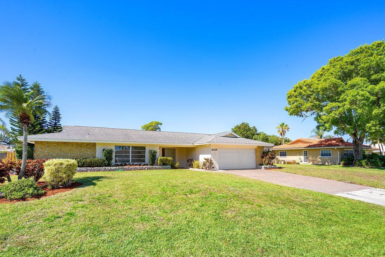RENOVATED home freshly painted both inside and out. New resilient vinyl plank Wood flooring. Renovated  patio deck and pool. Totally Remodeled owners Bath with new shower, flooring and vanity. Den could be a 4th bedroom. Both a great room and family room. Newer Roof and AC unit plus a 2 car garage and oversized private lot. Close to good schools, shopping, playgrounds, restaurants, cultural sites, I-95, the Turnpike and the airport.  No HOA fees. A great opportunity!