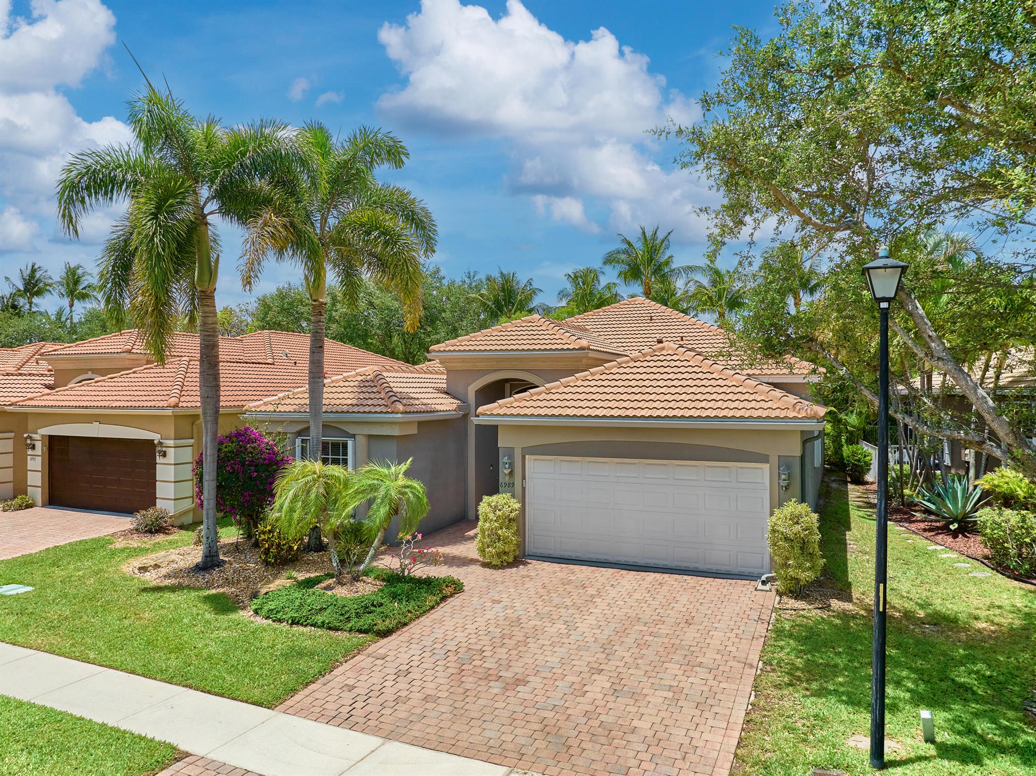 Welcome to resort-style living in the prestigious 55+ community of Villaggio! This beautifully maintained 4-bedroom, 2.5-bathroom home offers comfort, space, and a vibrant lifestyle. Step inside to find an inviting floor plan ideal for entertaining and everyday living. NEW ROOF 2025!Villaggio offers unmatched amenities including both indoor and outdoor swimming pools, a state-of-the-art fitness center, tennis courts, pickleball, bocce, racquetball, billiards, a full-service hair salon, on-site cafe, and endless clubs for every interest--from sports to entertainment. Enjoy the Florida lifestyle to the fullest in this active and welcoming community!