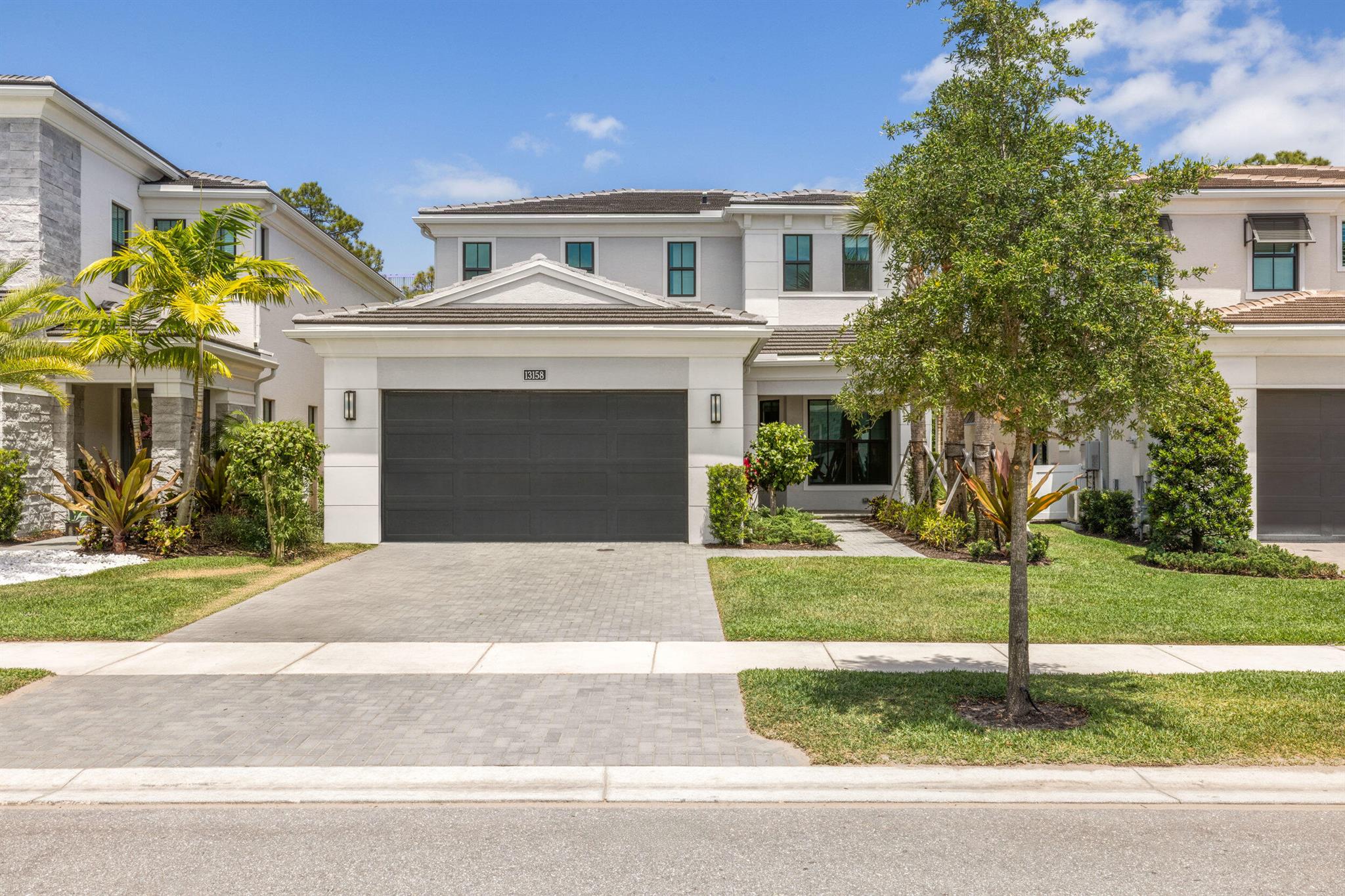 Seller financing available - Motivated Seller! Stunning 3BR/3.5BA in gated Artistry Palm Beach with 3,162 sq ft of luxury. Open-concept design, laminate wood floors, spacious great room, and chef's kitchen with GE Monogram appliances, gas cooktop, Advantium oven & breakfast nook. Covered patio pre-plumbed for summer kitchen & gas-ready for pool heater, perfect for your future backyard oasis. Ground-floor primary suite with frameless glass shower, tankless water heater, full laundry room with washer/dryer & 2-car garage. Resort-style amenities: clubhouse, fitness center, yoga studio, heated pool, basketball, trails & 24/7 manned security. The eat-in kitchen with breakfast nook provides the perfect space for casual dining, while the first-floor half bath adds convenience for guests.
Step outside to your private covered patio, pre-plumbed for a future summer kitchen and equipped with a gas stub-out ready for a pool heater&#x14;an incredible opportunity to create your dream backyard oasis. Additional upgrades include a frameless glass shower enclosure, exterior tankless water heater, and a dedicated laundry room with washer and dryer.
Artistry Palm Beach offers a resort-style lifestyle with access to a clubhouse, resort-style pool, state-of-the-art fitness center, yoga studio, resident lounge, basketball court, and scenic walking trails. With 24/7 manned security, you'll enjoy peace of mind in this beautifully maintained, amenity-rich community.
Experience the perfect blend of luxury, convenience, and comfort&#x14;schedule your private tour of 13158 Artisan Circle today and discover what makes this home truly exceptional.