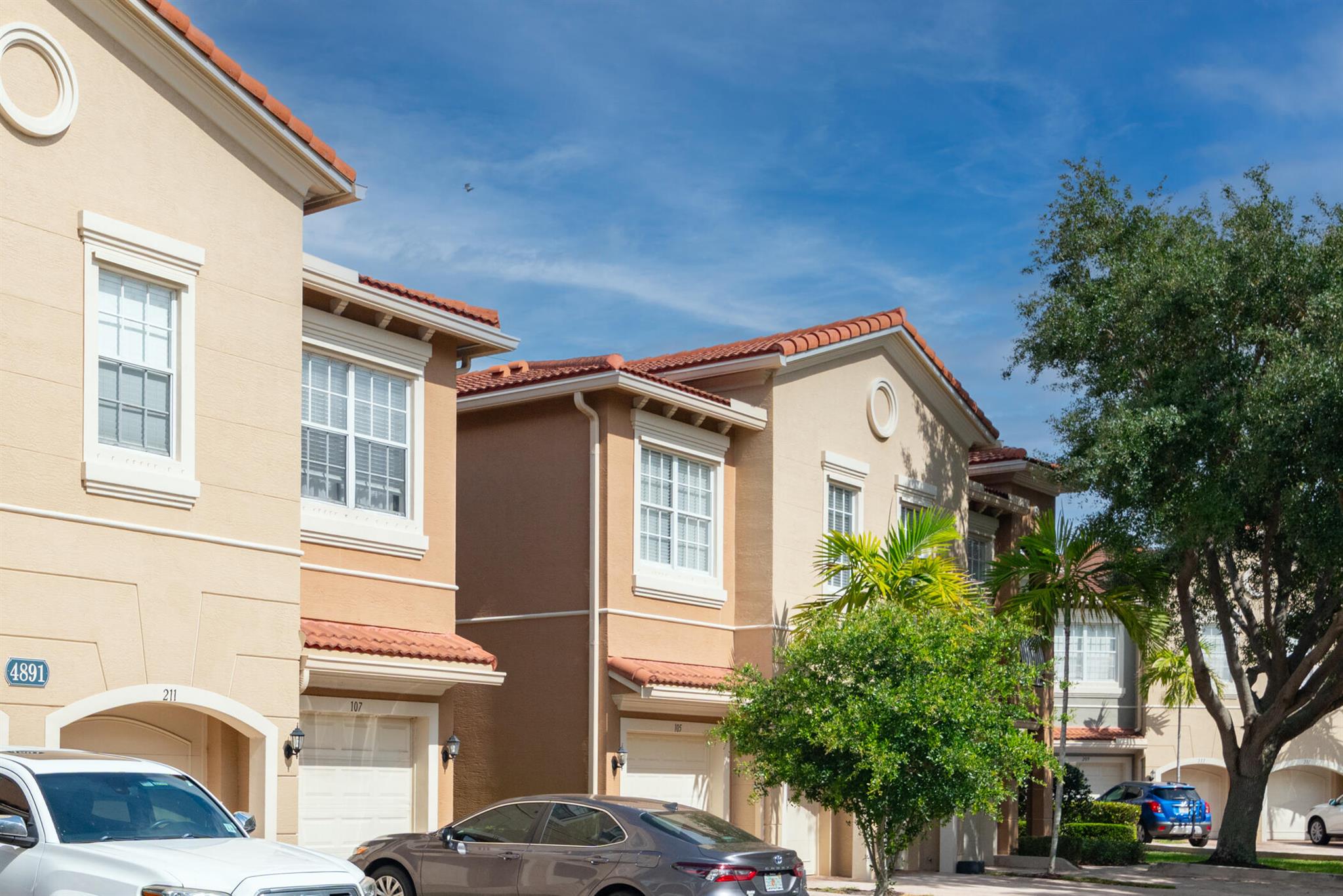 Location, location, location....this 3 BR/ 2.5 bath Townhouse-style condo is beautifully redone with timeless light luxury vinyl.  The upstairs bedrooms are flooded with natural light and new  high end carpet.  Large kitchen boasts new range, new refrigerator and  beautiful wood cabinetry with loads of storage space. Washer/dryer is conveniently located on the 2nd floor, with a new washer and dryer thats ultra quiet!Enjoy high ceilings with loads of recessed lighting throughout.  The covered patio backs up to a treed view offering privacy as you enjoy watching nature. Walking distance to shops, restaurants and the night life that Alton has to offer.Close to beaches, PBI, Golf and Gardens Mall!Partial furnishings negotiable.