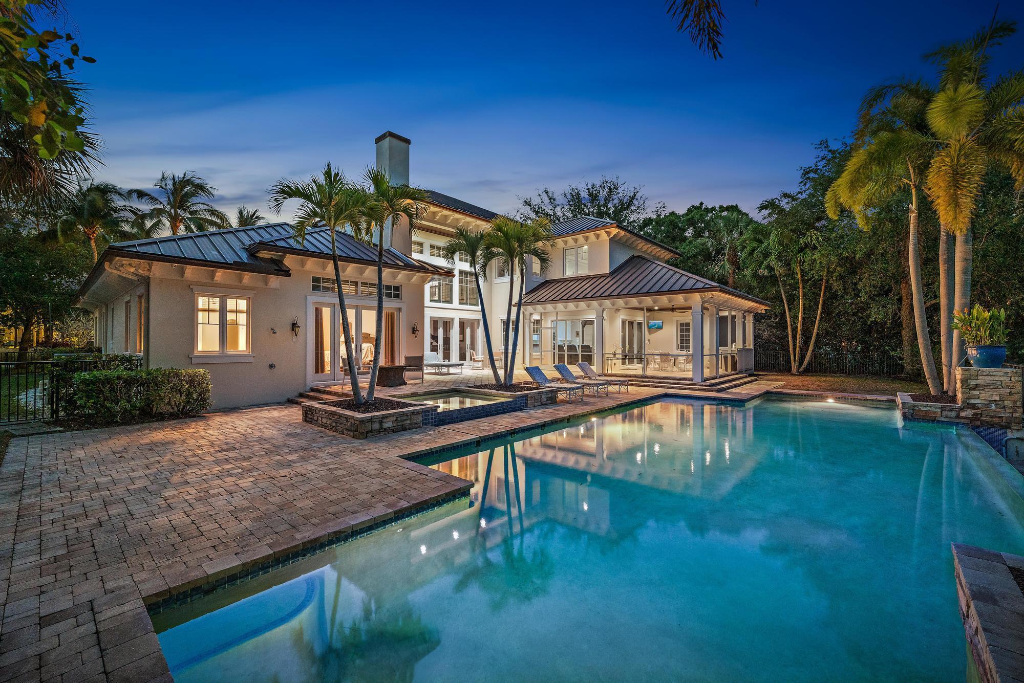 Experience the ultimate in luxury and privacy in this stunning estate masterfully crafted by Purucker & Marrano Custom Homes.  Only minutes to Palm Beach International Airport, beautiful beaches and 5-star dining, this home is perfectly situated on a prestigious cul-de-sac lot within the renowned gated golf community of Old Marsh Golf Club. Overlooking the 5th tee of the signature hole on the Pete Dye championship golf course, this residence offers breathtaking water and fairway views, a tranquil setting amid an Audubon-designated preserve. With no tee times required and a renowned caddie program, Old Marsh provides an exclusive and intimate golf experience unlike any other.  Meticulously designed, this 5-bedroom, 5.2 bathroom estate features an expansive floor plan, MORE... seamlessly blending elegance with functionality. The sprawling first-floor primary suite boasts a private sitting room or fitness area with direct access to the 55-foot saltwater infinity pool, creating a true retreat. A main level guest suite with a separate, private exterior entry ensures maximum privacy for guests.  

The gourmet kitchen is a chef's dream, fully equipped with dual Sub-Zero refrigerators, Wolfe ovens, Miele dishwashers, and a warming drawer&#x14;ideal for entertaining. Upstairs, a spacious loft with built-in dual desks is complemented by three additional ensuite bedrooms.  

Outdoor living is elevated with a covered lanai featuring a new six-burner grill, perfect for al fresco dining. Additional highlights include a whole-home sound system, an oversized three-car garage, a 45 KW generator, a whole-house water filtration system, and extensive storage.  

This extraordinary home is a sanctuary of serenity, offering an unparalleled blend of luxury, nature, and world-class golf.