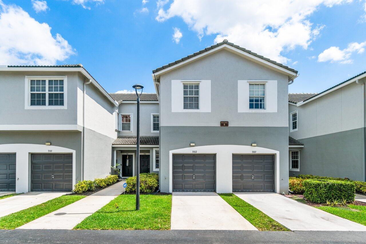 Welcome to the largest townhouse currently on the market in Magnolia Bay--a bright, spacious, and move-in ready home offering nearly 2,000 square feet of living space, plus a bonus screened-in porch for added indoor-outdoor enjoyment.This well-designed floor plan features an open-concept living area on the main level, ideal for entertaining, and all bedrooms tucked privately upstairs. The kitchen is equipped with sleek stainless steel appliances, upgraded cabinetry, and a walk-in pantry for extra storage.Enjoy stylish tile and vinyl flooring throughout, an attached 1-car garage, and a layout that feels both comfortable and functional.Don't miss your chance to live in one of Palm Beach County's most desirable communities--Live Where Others Vacation.