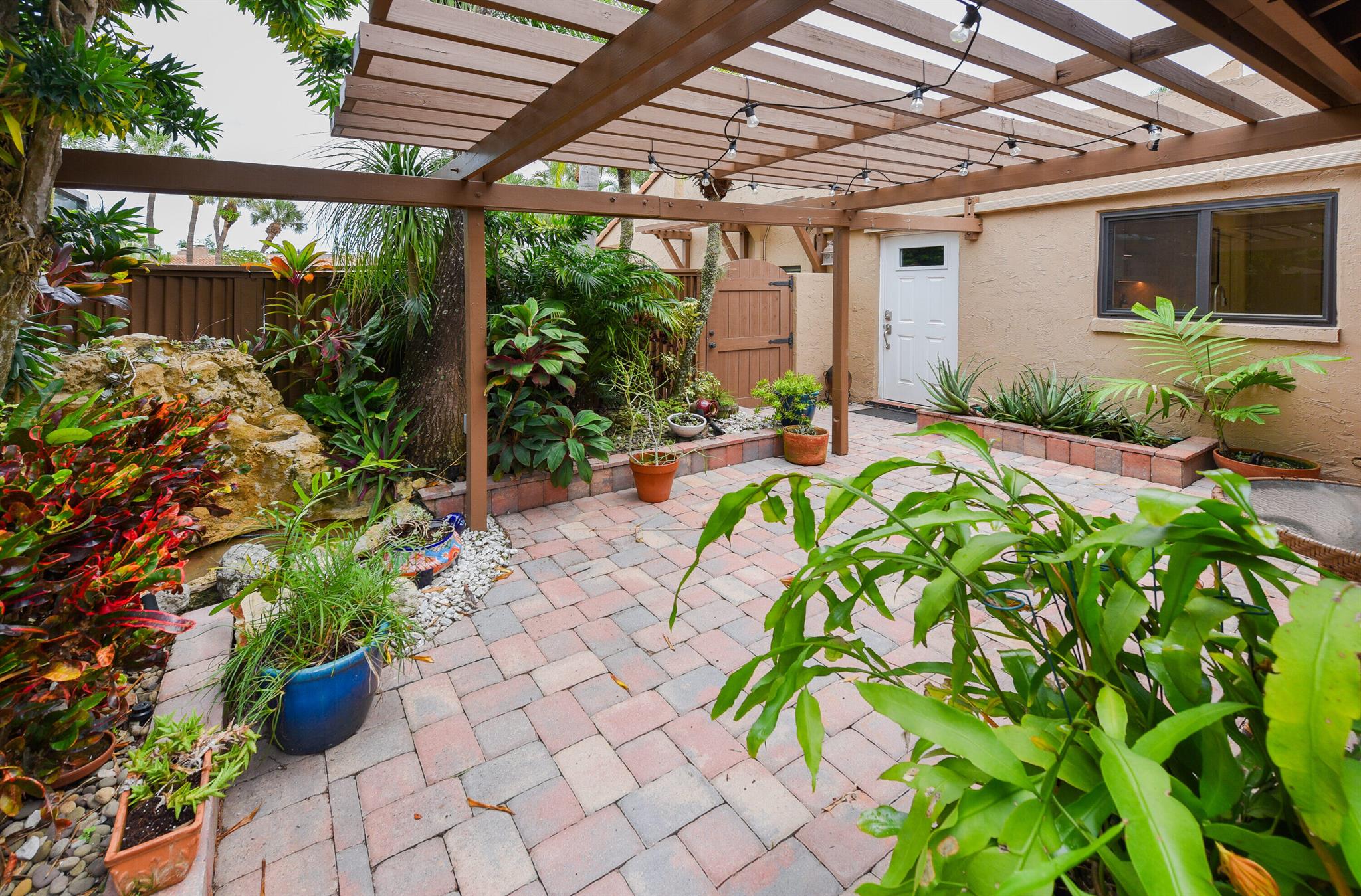 Recently remodeled, unique pool home provides all of your creature comforts in a beautiful & friendly neighborhood. Immaculately kept, this charming, Spanish-inspired, 1-story villa boasts the best of indoor & outdoor living, w/ large heated private pool, jacuzzi, enticing patios, BBQ area, beautiful gardens, & indoor and outdoor dining areas. Enjoy a private yard and a tropical paradise. This unique, showcase home boasts a semi-open floor plan w/ ample natural light, perfect for relaxing or entertaining while surrounded by nature's beauty. This home offers a fantastic blend of comfort, style & friendly community living. 5 miles to the beaches & close to Boca's most popular restaurants, places of worship & unique shopping experiences. A-rated schools; grades 1-12. Come & see 4 yourself