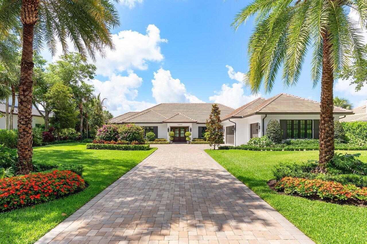 Magnificent 4-bedroom, 4-bathroom residence in Old Marsh Golf Club, spanning 3,615 sq ft of living space and 4,773 total sq ft on a lush, nearly 2/3-acre lot, meticulously landscaped with mature trees. Fully transformed by the esteemed JMA Interior Design, this single-story home offers unparalleled vistas of the water, marsh, and the 7th hole of the iconic Pete Dye-designed championship golf course. From the moment you step inside, the sweeping views captivate, creating an instant connection to the serene surroundings.The grand primary suite is a haven of luxury with two walk-in closets, bathroom with marble finishes, frameless glass shower, and dual vanities. The impressive, gourmet eat-in kitchen has all new cabinetry and appliances, including an induction cooktop and walk-in pantry.  The versatile floor plan includes a study/den with an adjacent full bath, easily convertible to a fourth bedroom, plus two additional bedrooms, each with custom window treatments and en-suite bathrooms.
Relax or entertain on the screened lanai overlooking the pool, spa, and golf course, framed by the tranquil landscape and pergola. Exceptional features include beautiful hardwood floors, impact-resistant windows and doors, steam shower, a formal dining area, and a welcoming family room that seamlessly connects to the outdoor oasis. Every element of this move-in-ready home reflects meticulous craftsmanship.
This prestigious gated community offers access to Old Marsh Golf Club's renowned amenities, including a no-tee-time policy, a top-tier caddy program, award-winning facilities, and Audubon-certified grounds, all just moments from Palm Beach's vibrant destinations. Membership application to Old Marsh Golf Club is required for the buyer.  $300,000 Golf Membership, $325/month Capital Contribution, and $24,600 Annual Dues. Garage car charger is excluded.